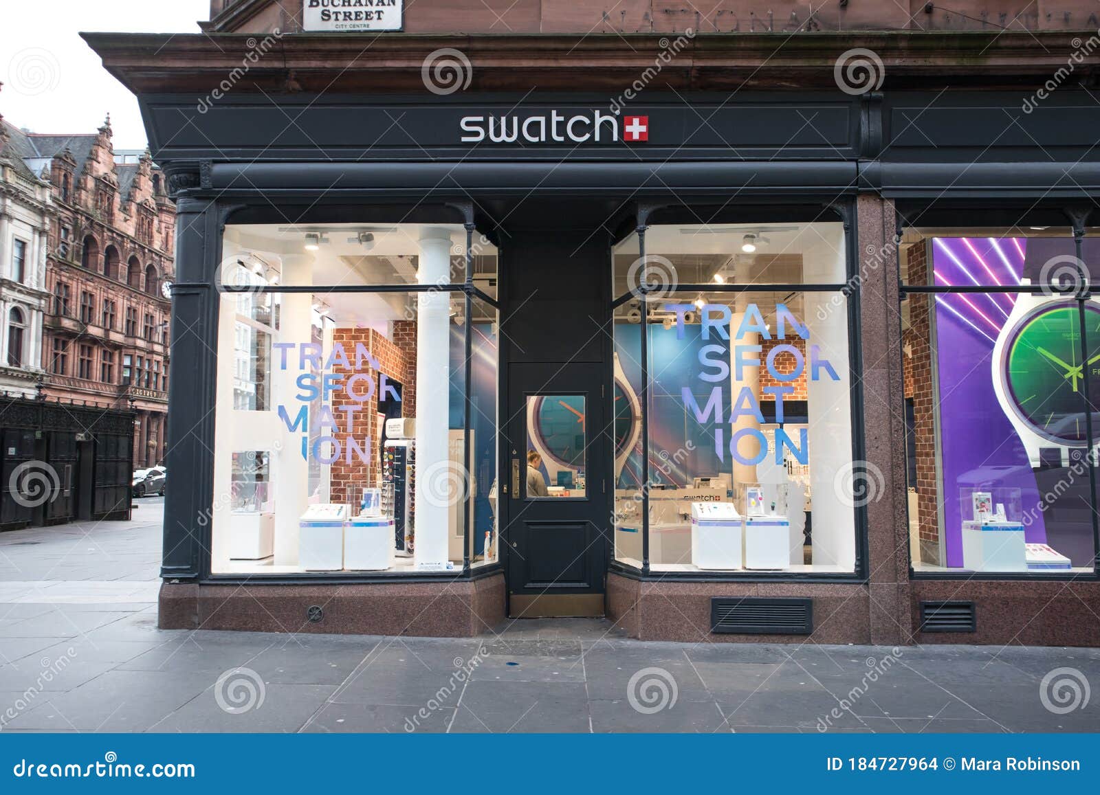 Glasgow / Great Britain : Exterior of Swatch Watch store showing window display, logo, branding and signage