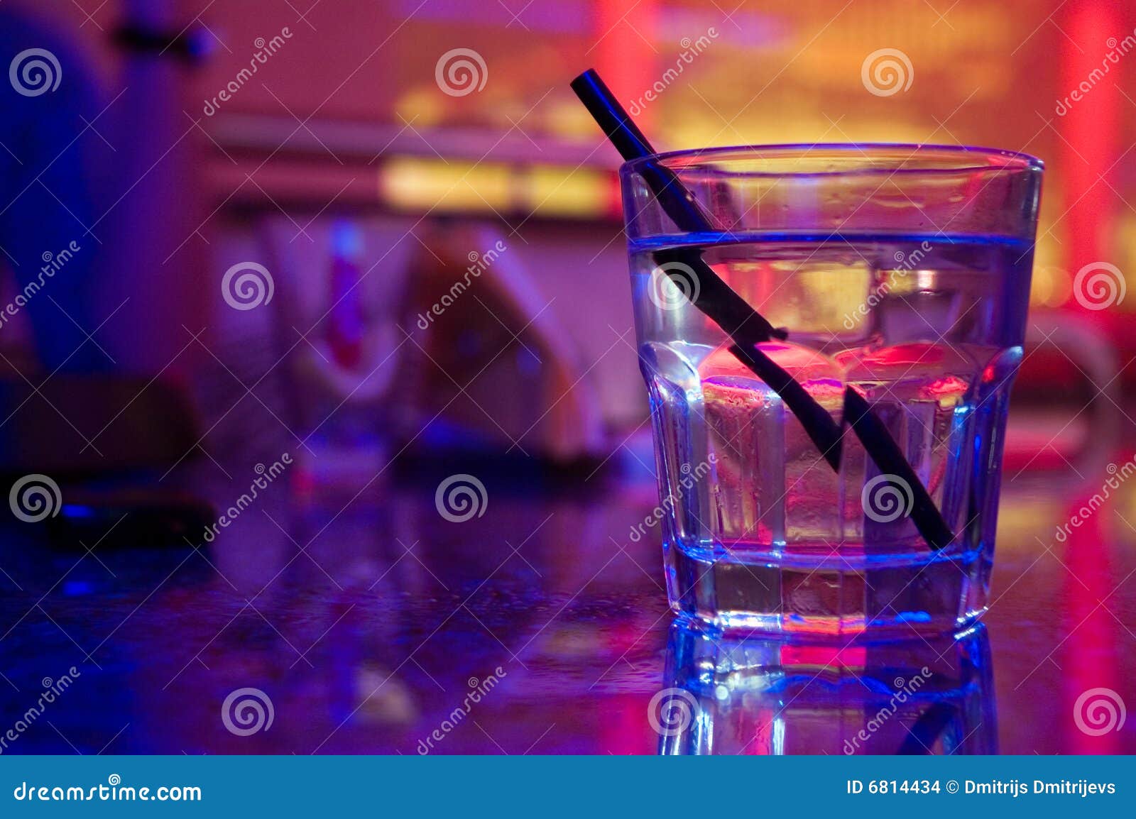glass of alcohol drink in the night club
