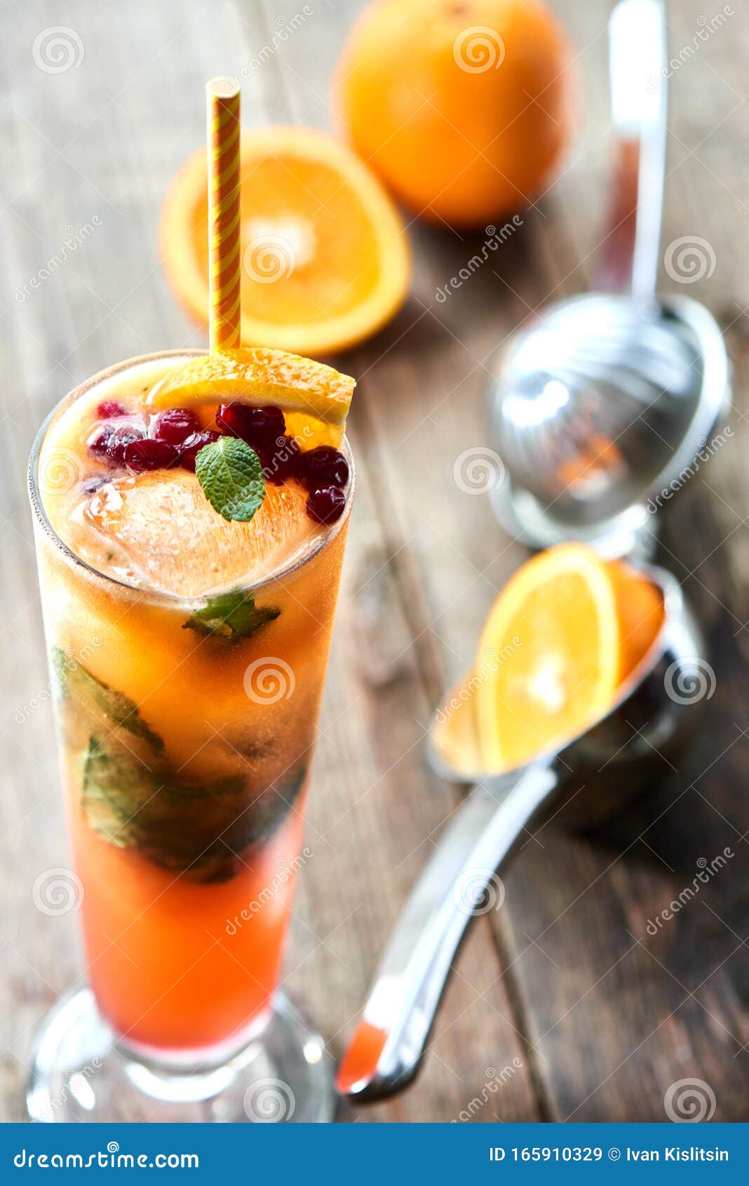 The Glass of Alcoholic Cocktail Sex on the Beach Homemade Cranberry, Mint, Orange and Peach Juice on a Wooden Table Closeup Stock Image