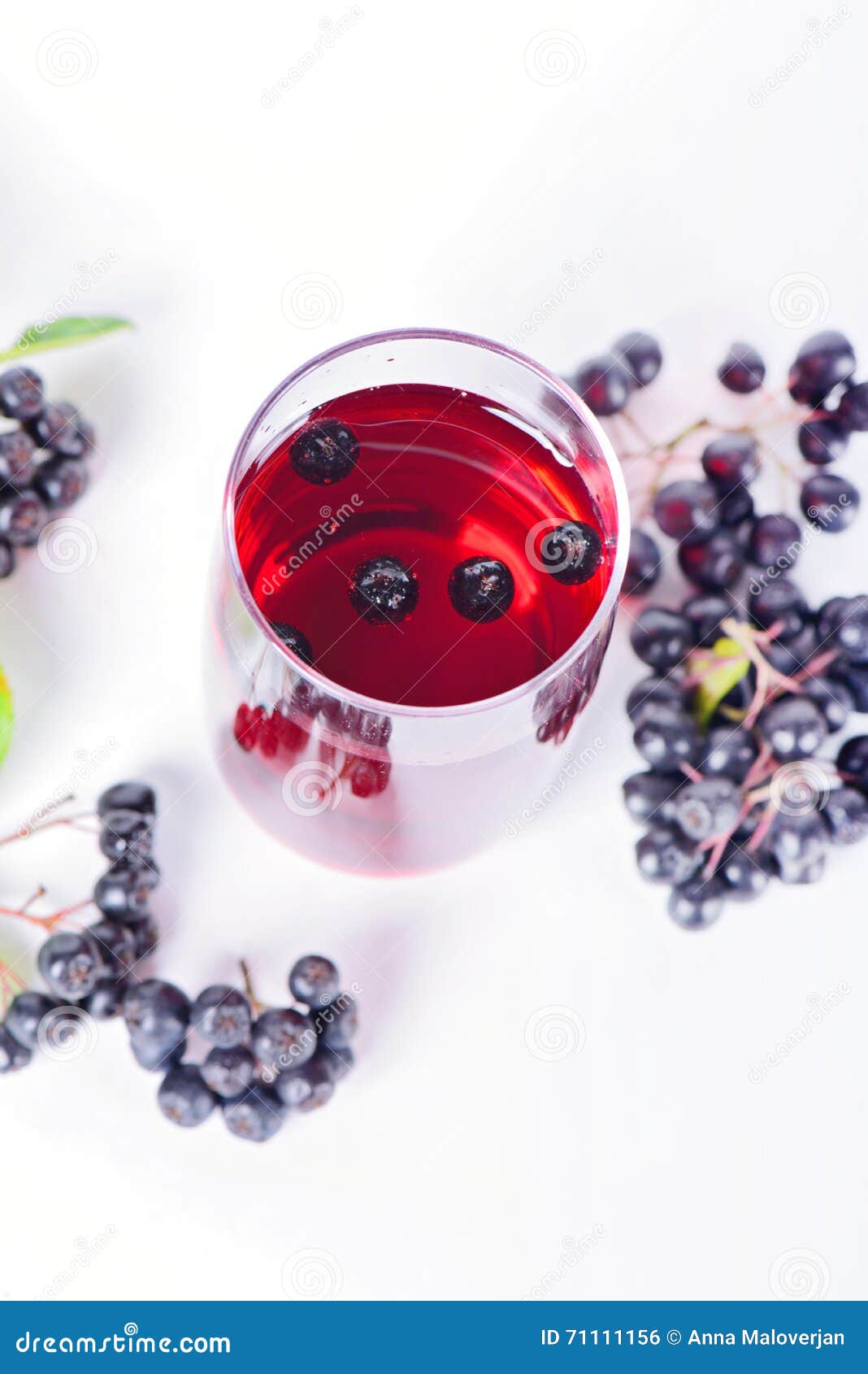 glass of aronia juice with berries, overhead view