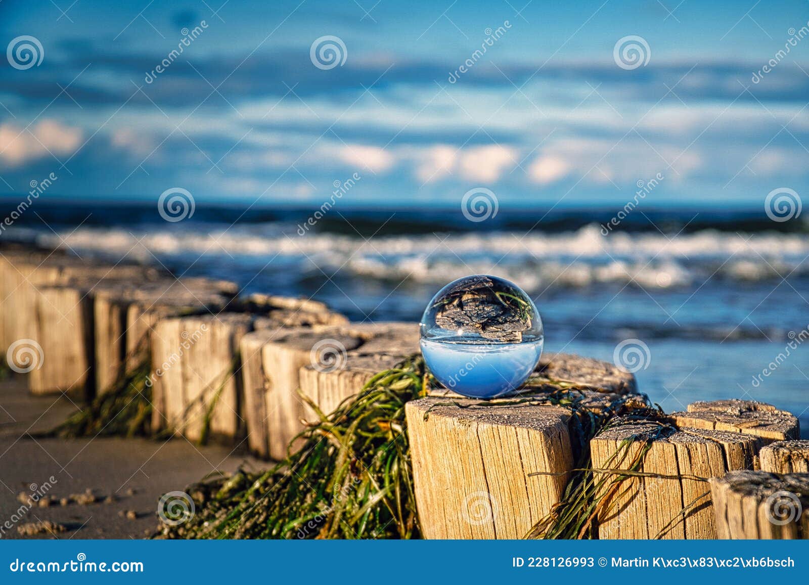 Glass Ball on Beach, Capturing the Landscape in the Glass Stock Image
