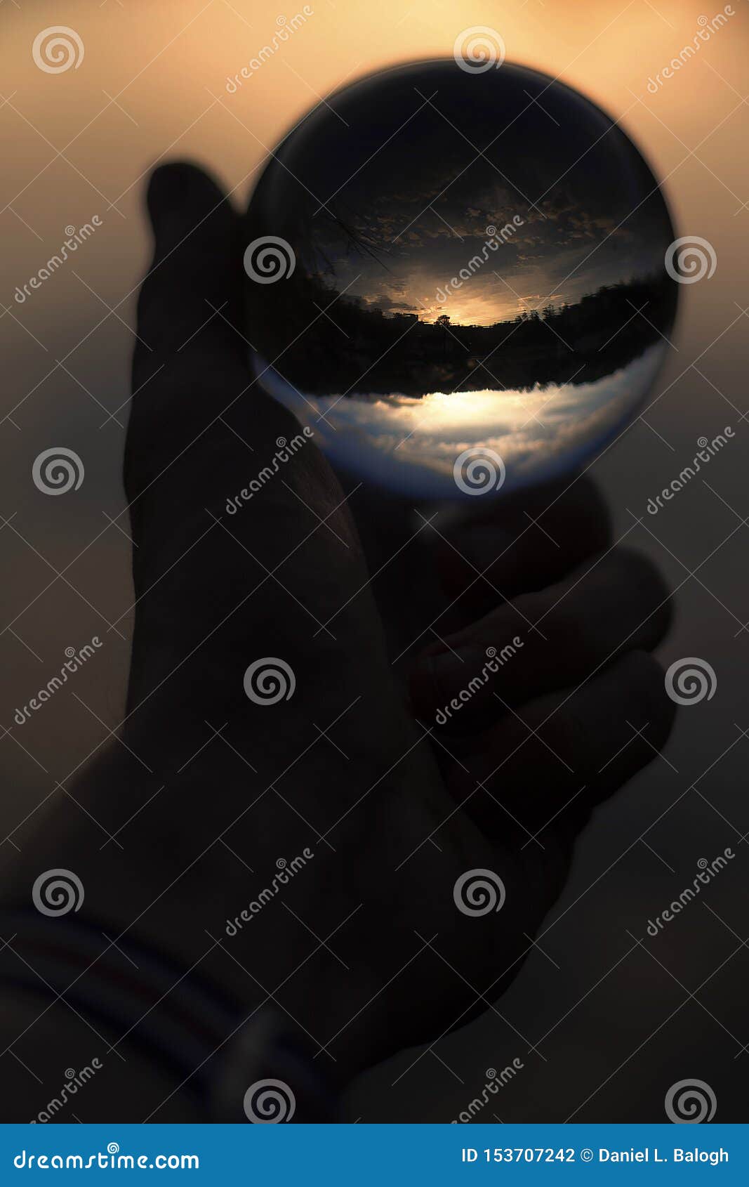 Glass Ball in Hand with Sunset Reflection Stock Photo Image of