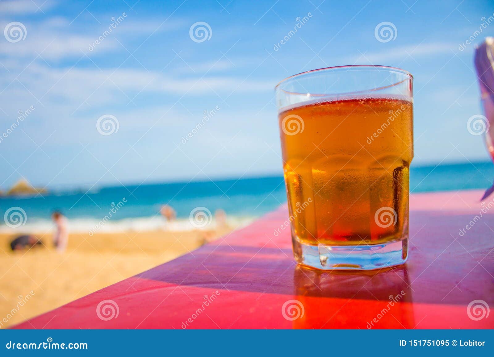 glass of beer on the beach in oaxaca