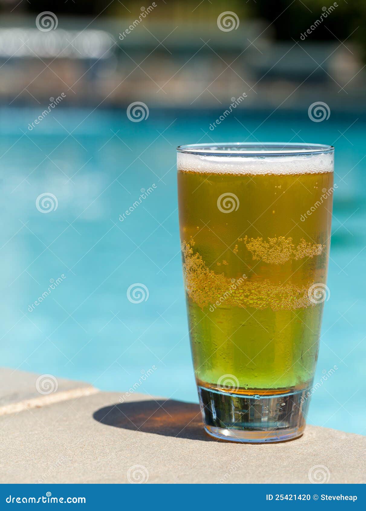 Glass of Beer on Edge by Poolside Stock Photo Image of beer, pint