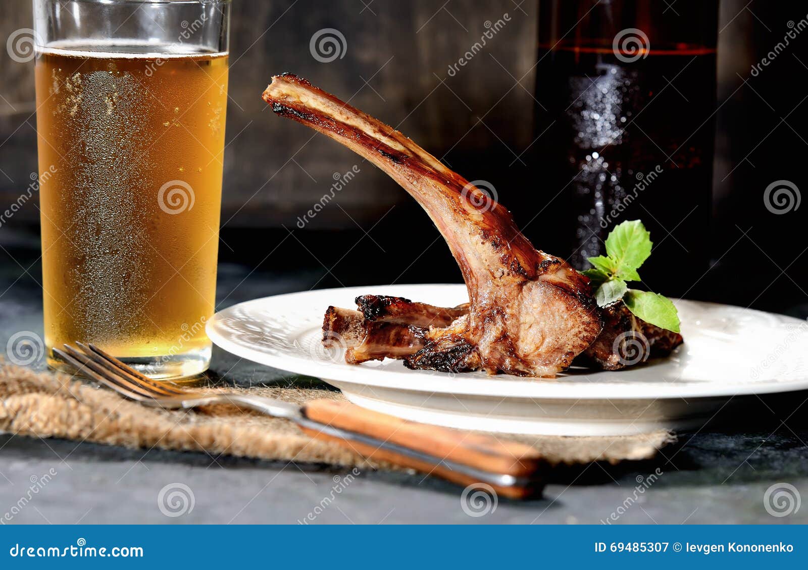 A Glass of Beer, Fried Lamb Chops with Garlic and Other Spices Stock