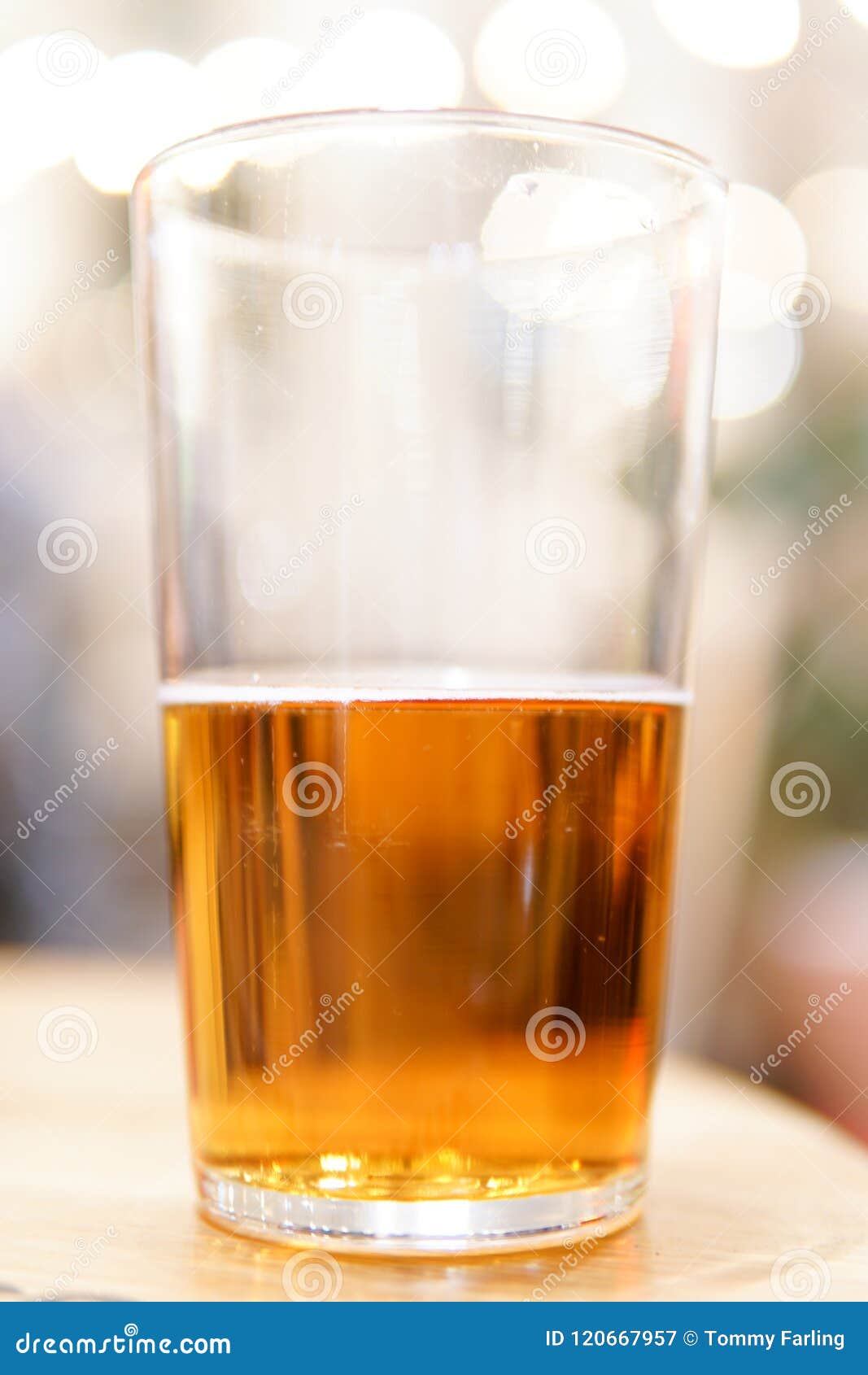 Glass of beer half full stock image. Image of weekend 120667957