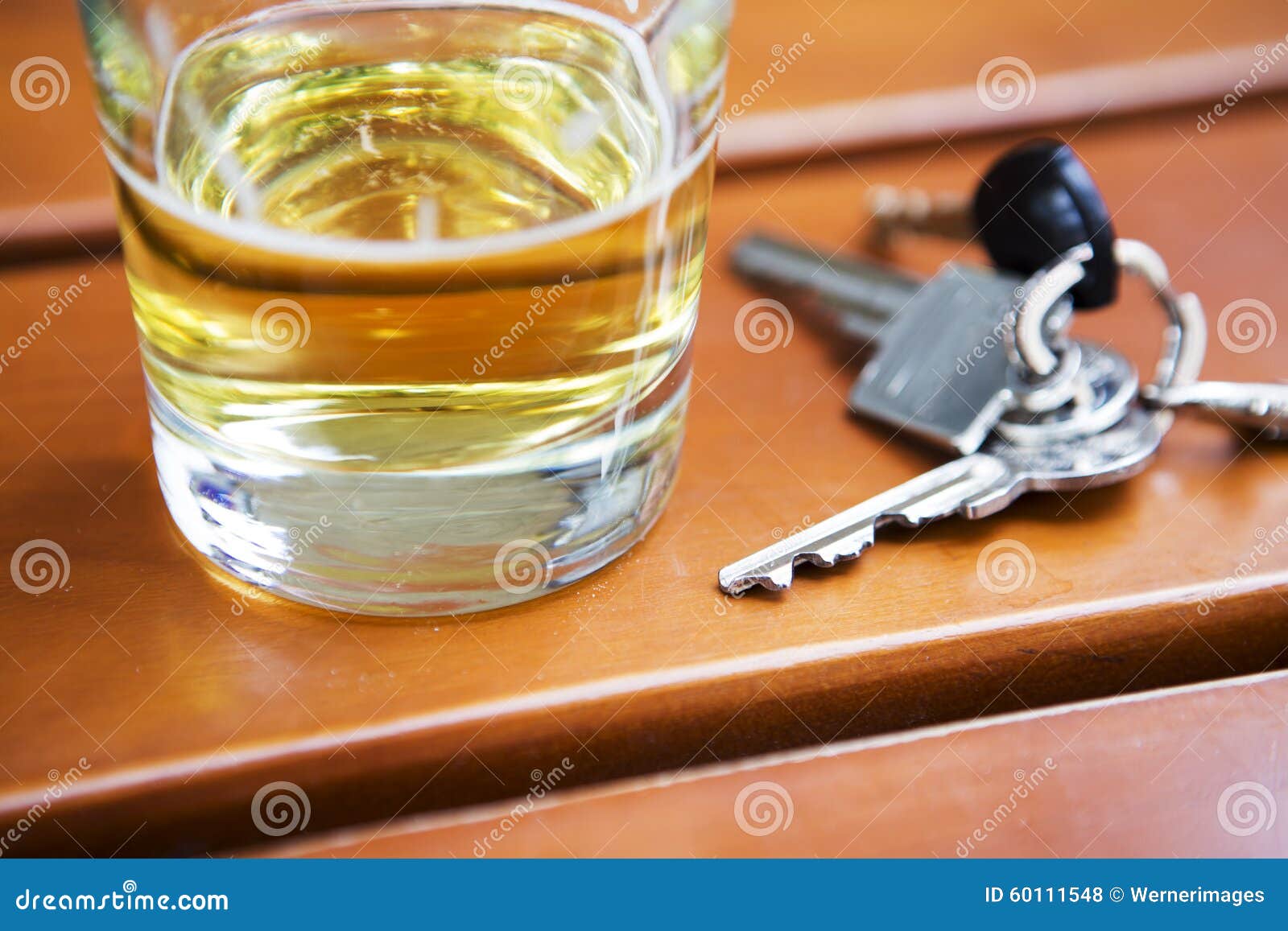 Glass of beer with key stock photo. Image of alcoholism 60111548