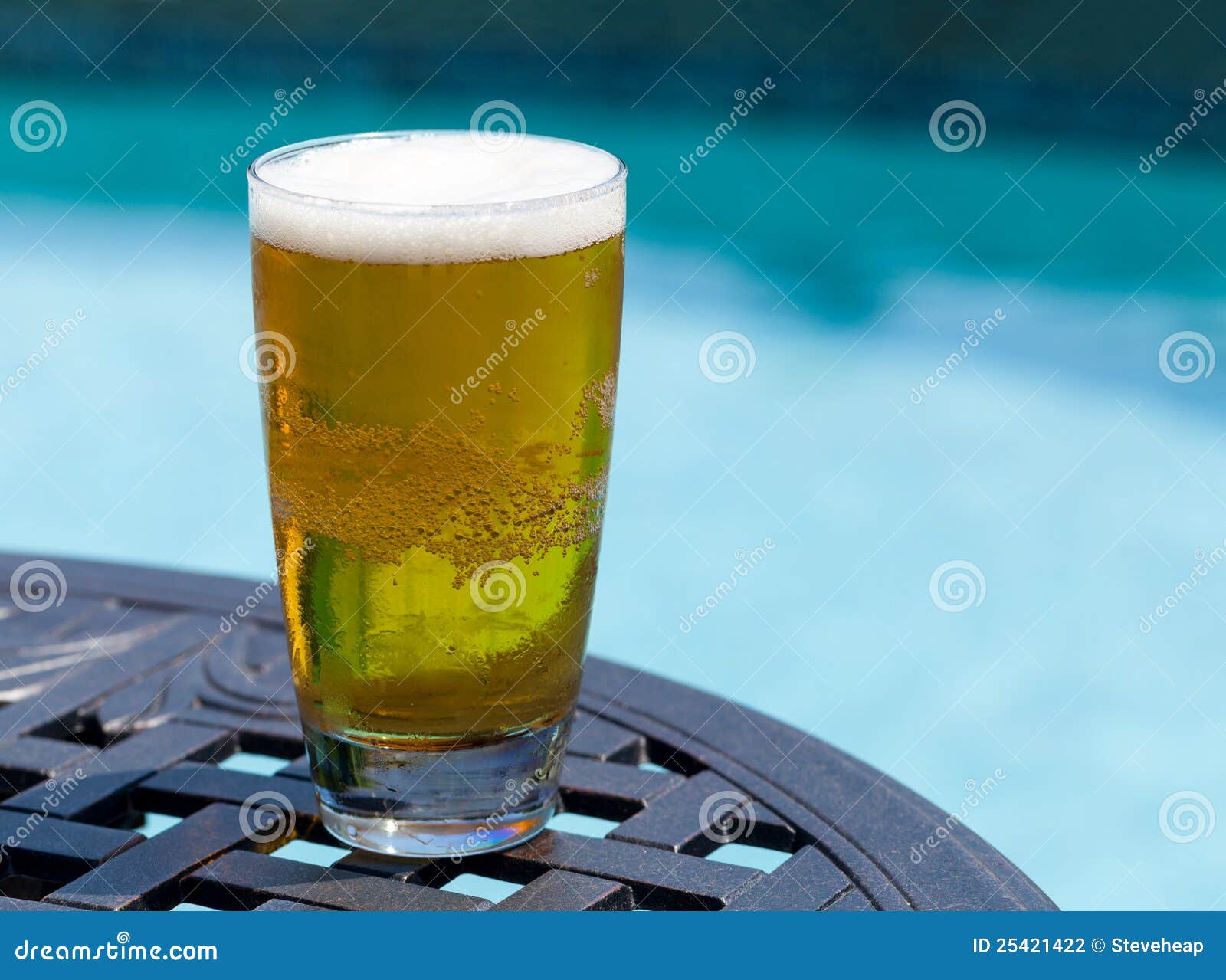 Glass of Beer on Table by Poolside Stock Photo Image of alcohol