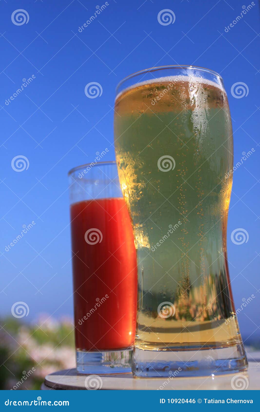 Glass of Beer, Tomato Juice and Ocean Stock Photo Image of closeup