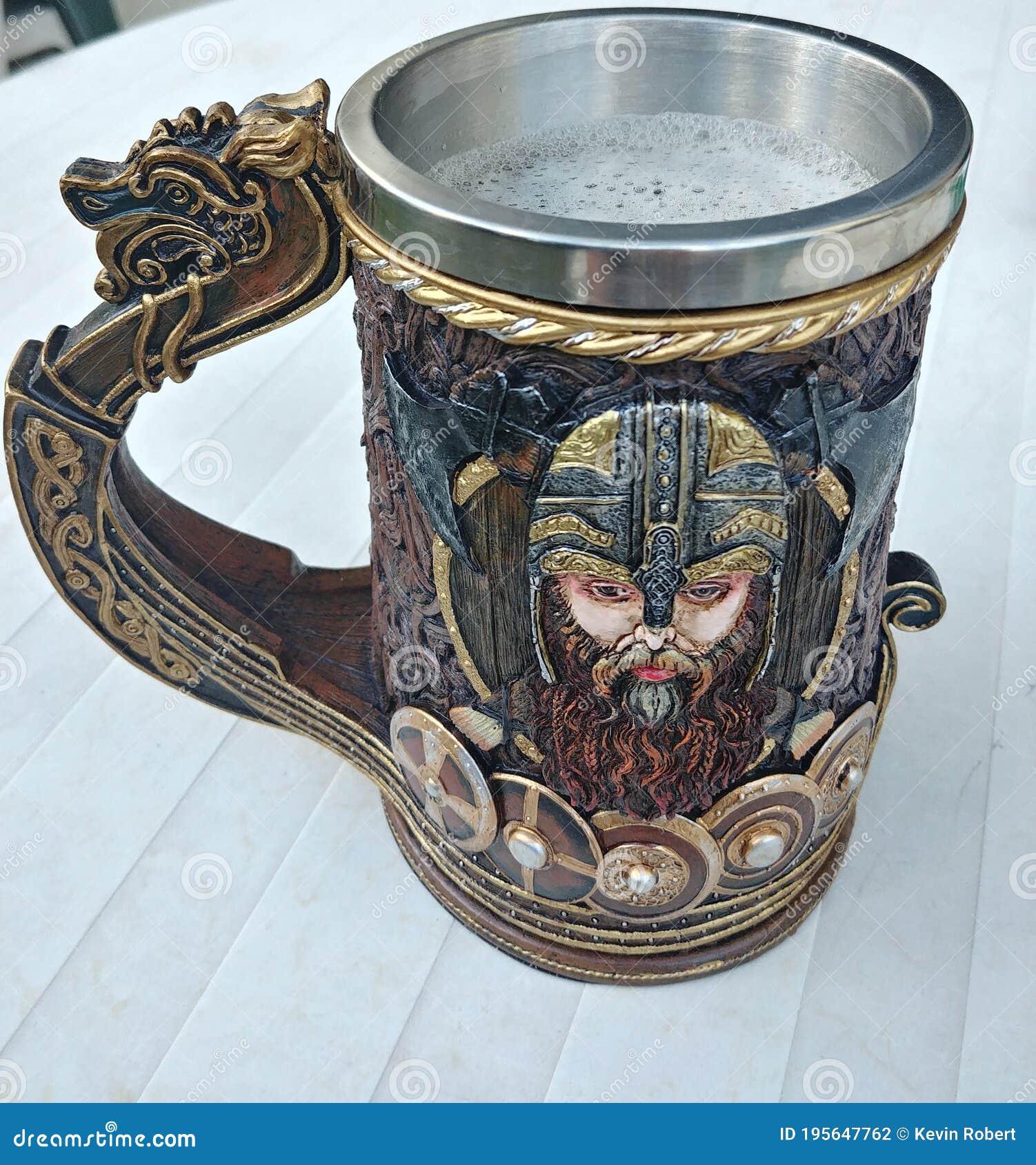 Glass of Beer with a Viking Layout on a White Table Editorial