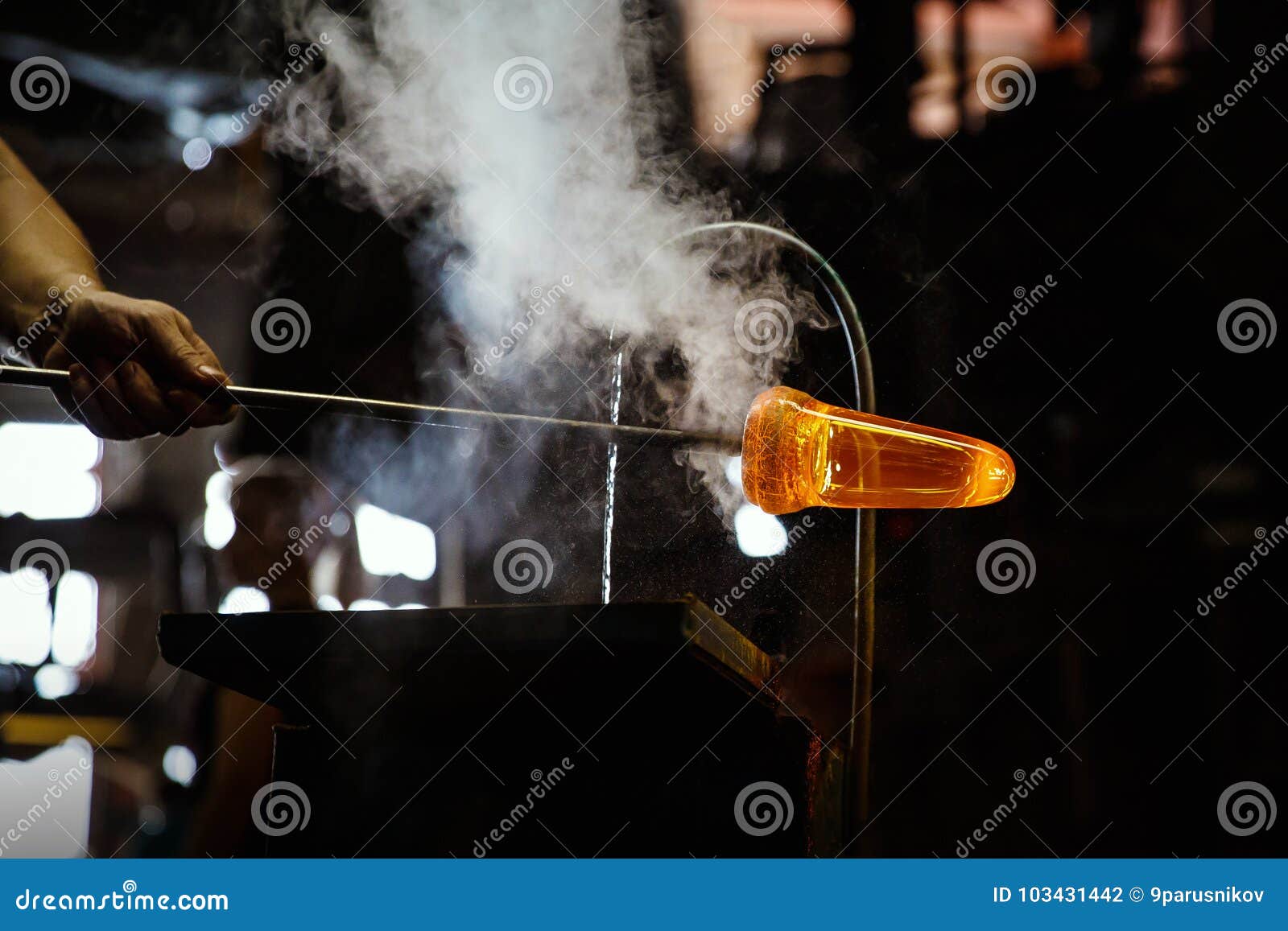 Glass Blower Forming Piece of Glass, Water Cooling. Stock Photo Image