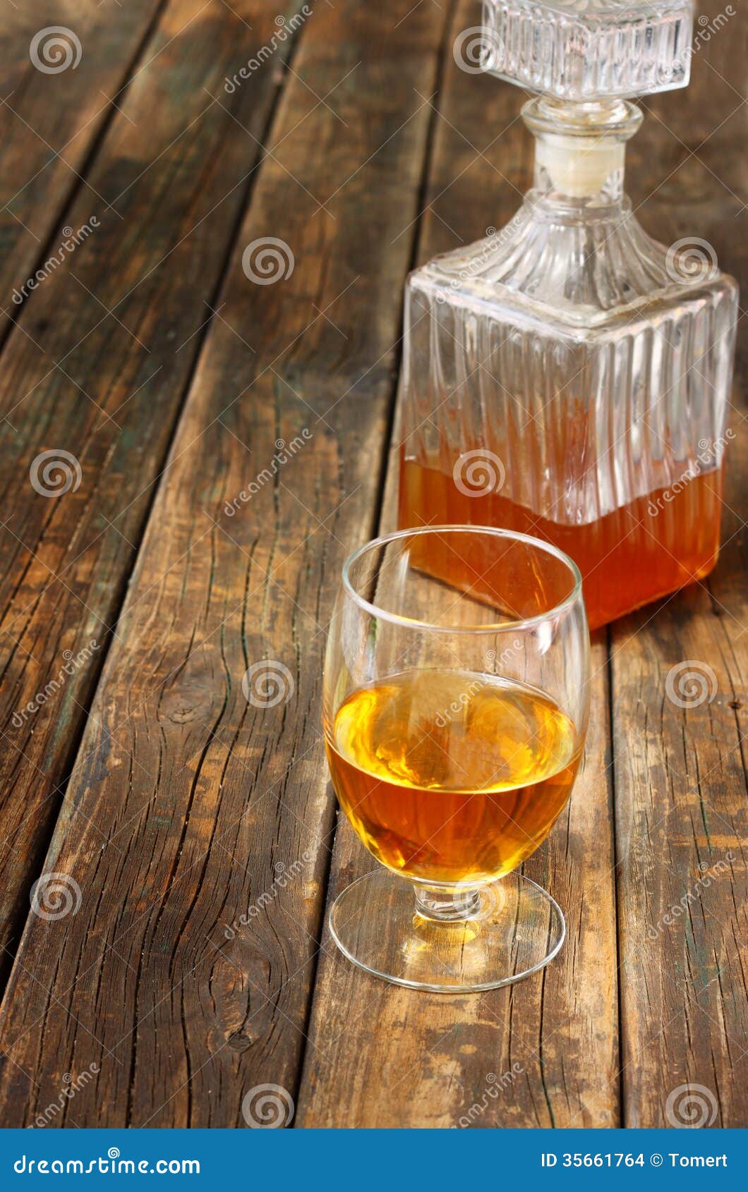 Glass And Bottle Of Liquor Like Scotch, Bourbon, Whiskey Or Brandy On