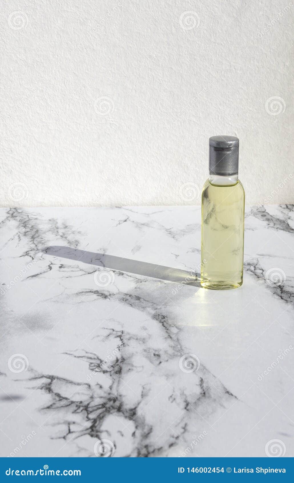 Glass Bottle Of Natural Oil On Marble Background. Natural Organic Skin Care Beauty Products