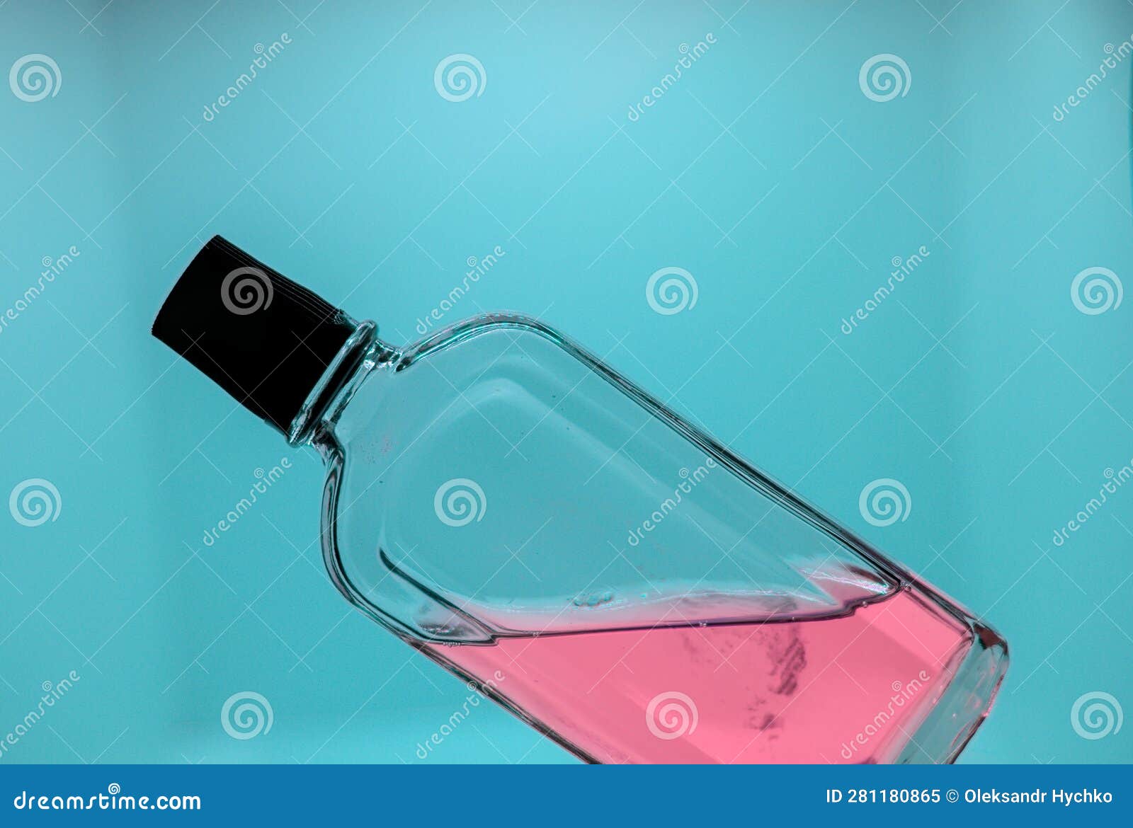 Glass Bottle with Red Cologne on Blue Background Stock Image Image of