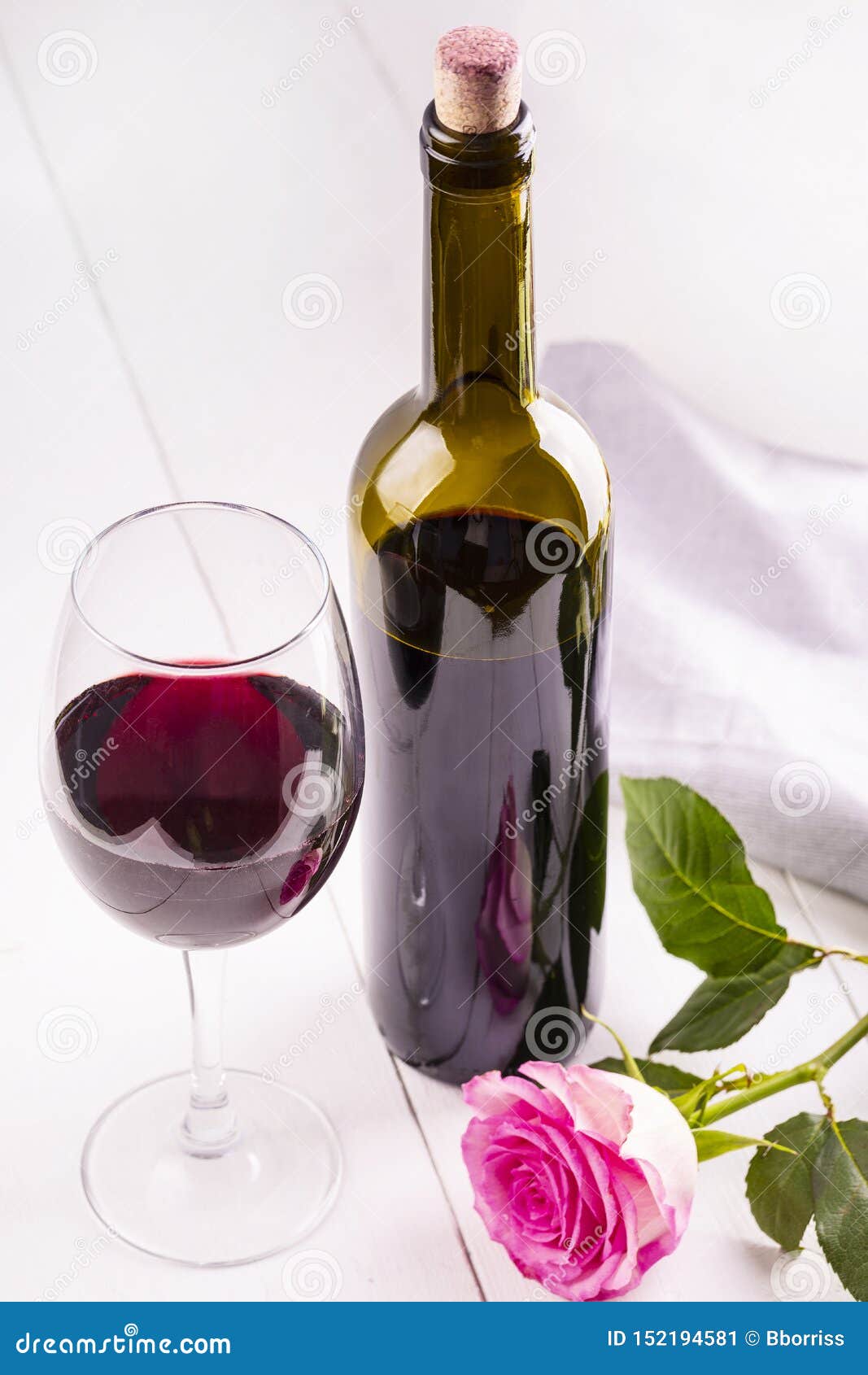 The Glass Bottle of Wine with Corks and Rose on White Wooden Table Stock Image Image of liquid