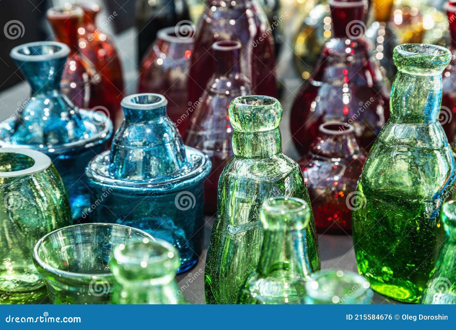 Glass Bottles Made of Multicolored Glass in Production Stock Photo