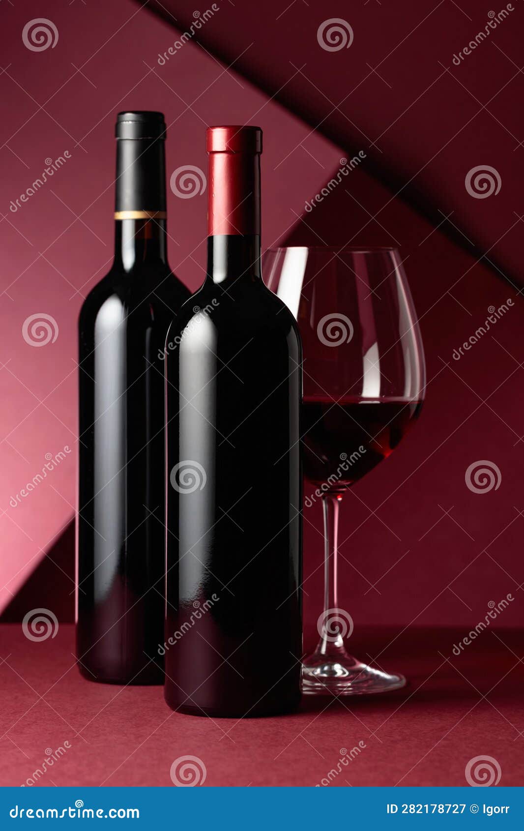 Glass and Bottles of Red Wine on a Red Background Stock Image Image of sauvignon, tasting