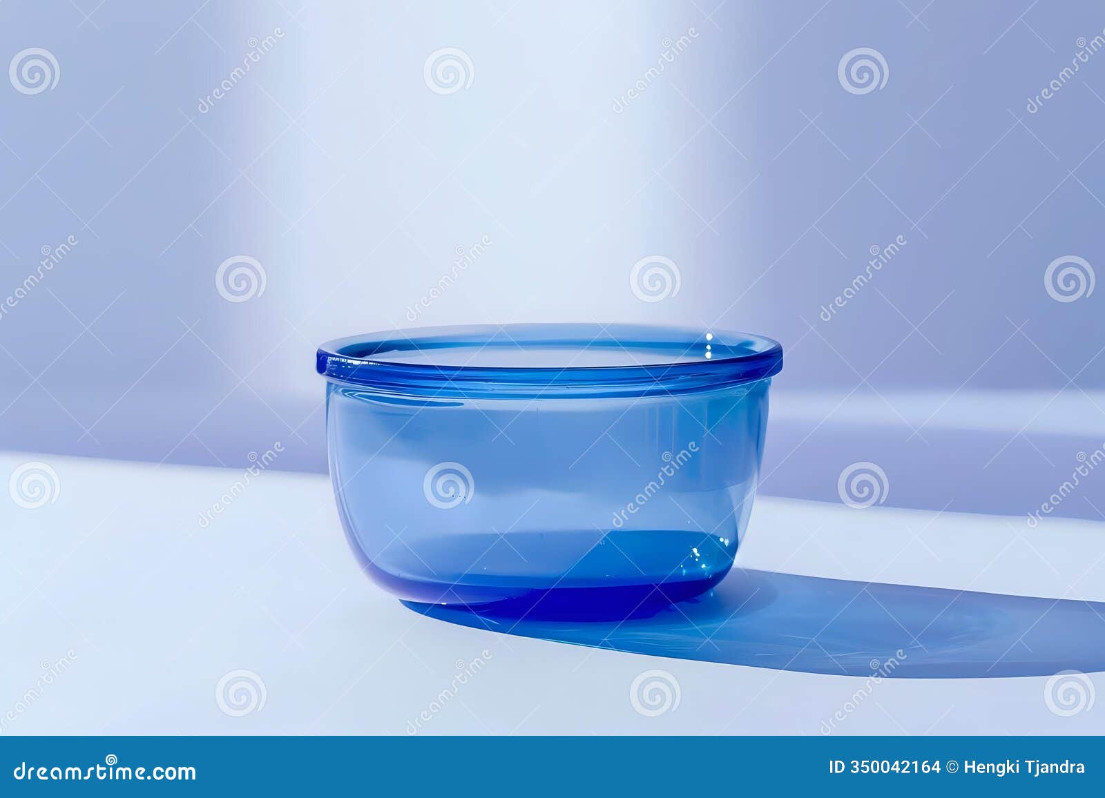 glass bowl reflecting light: a study in blue hues and shadows, captivating minimalist aesthetic with tranquil ambiance. exploring