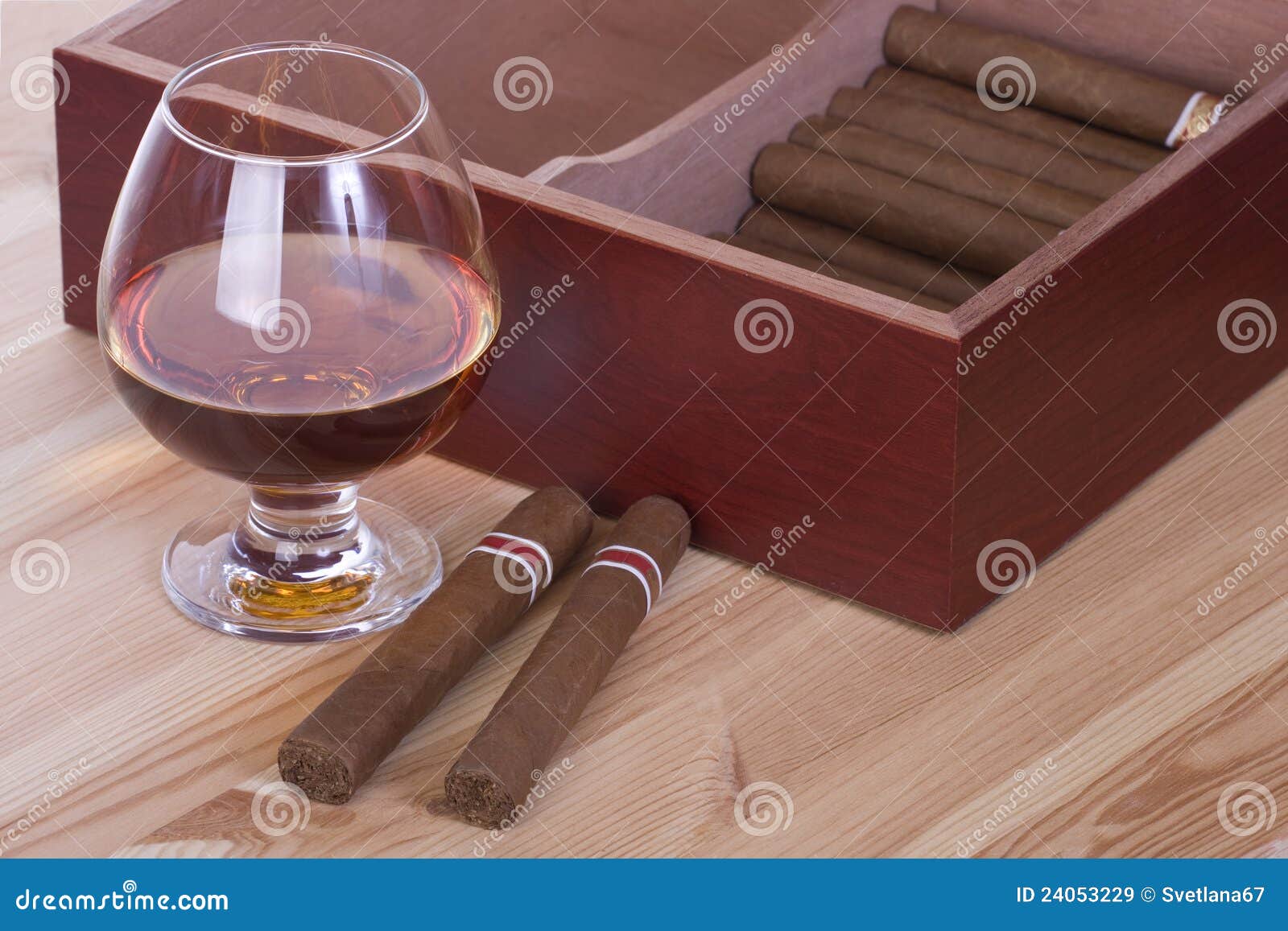 glass of brandy and cigars