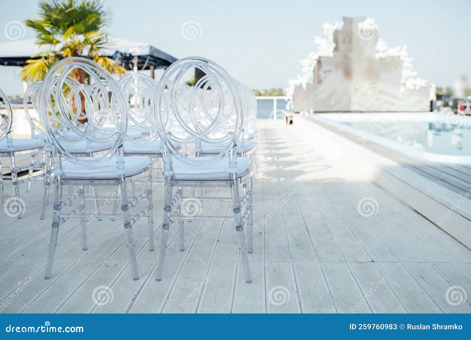 Glass Chairs Stand in a Row in a Beautiful Wedding Outing Ceremony