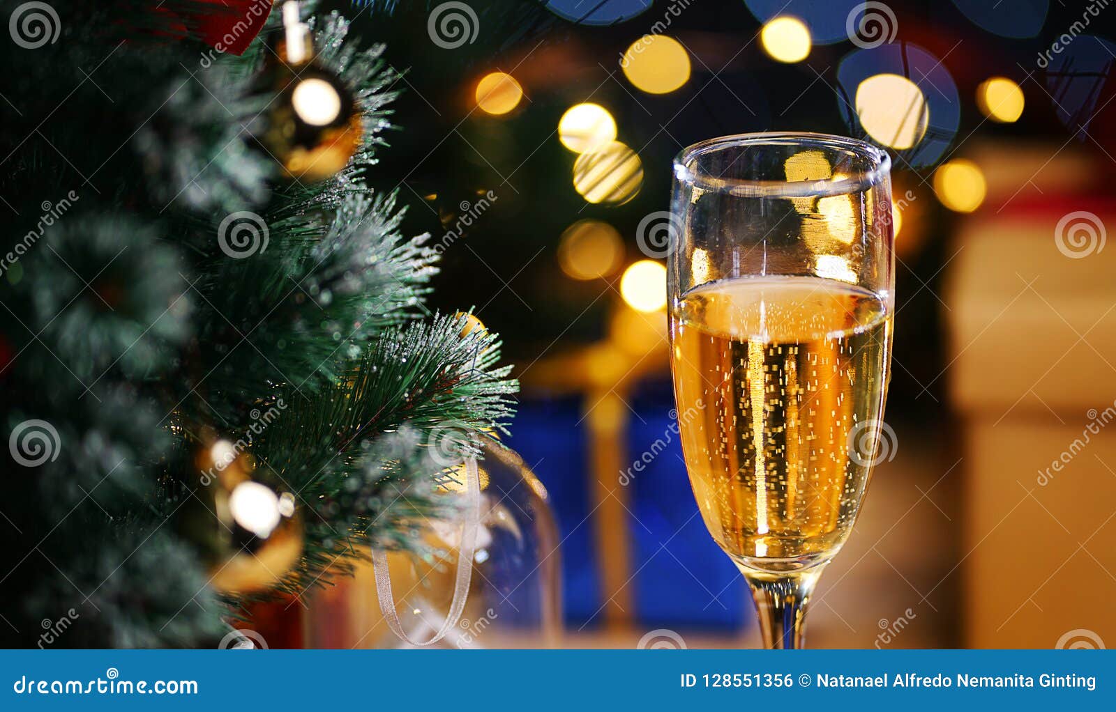 Glass of Champagne beside Christmas Tree. Close Up Shot Stock Photo ...