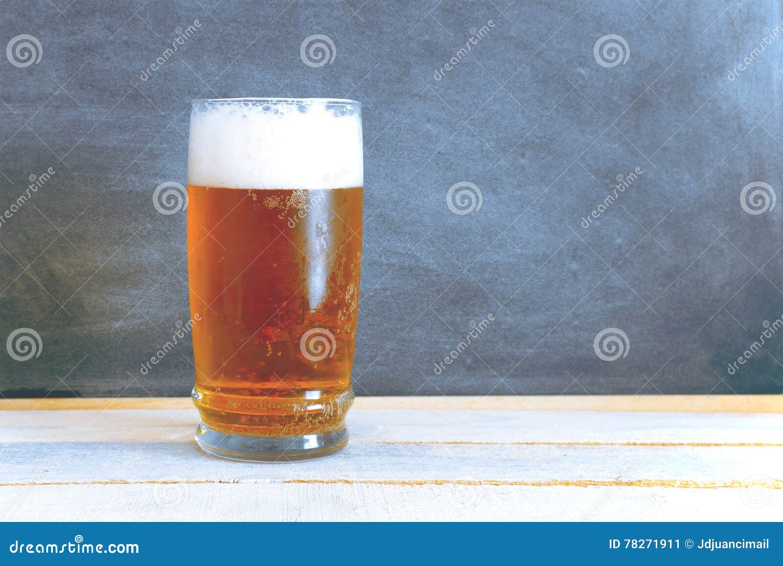 A Glass of Chilled Beer on a White Wooden Table. Stock Image Image of