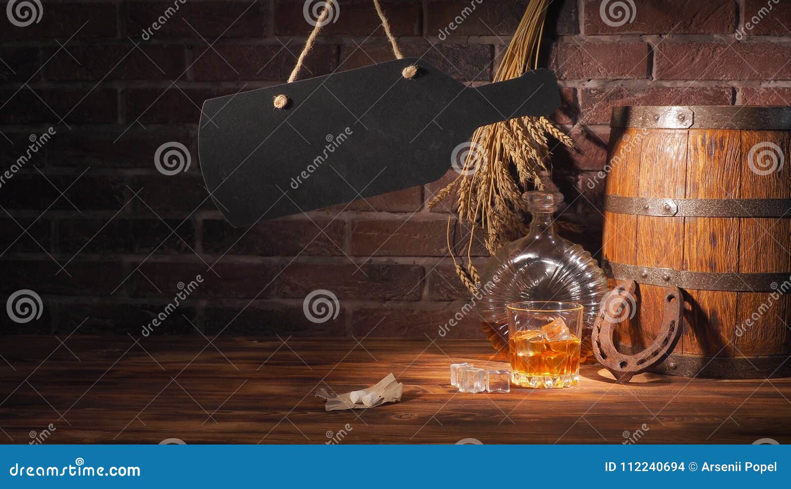 Glass of Cognac with Barrel on Brick Backgroun Stock Photo - Image of