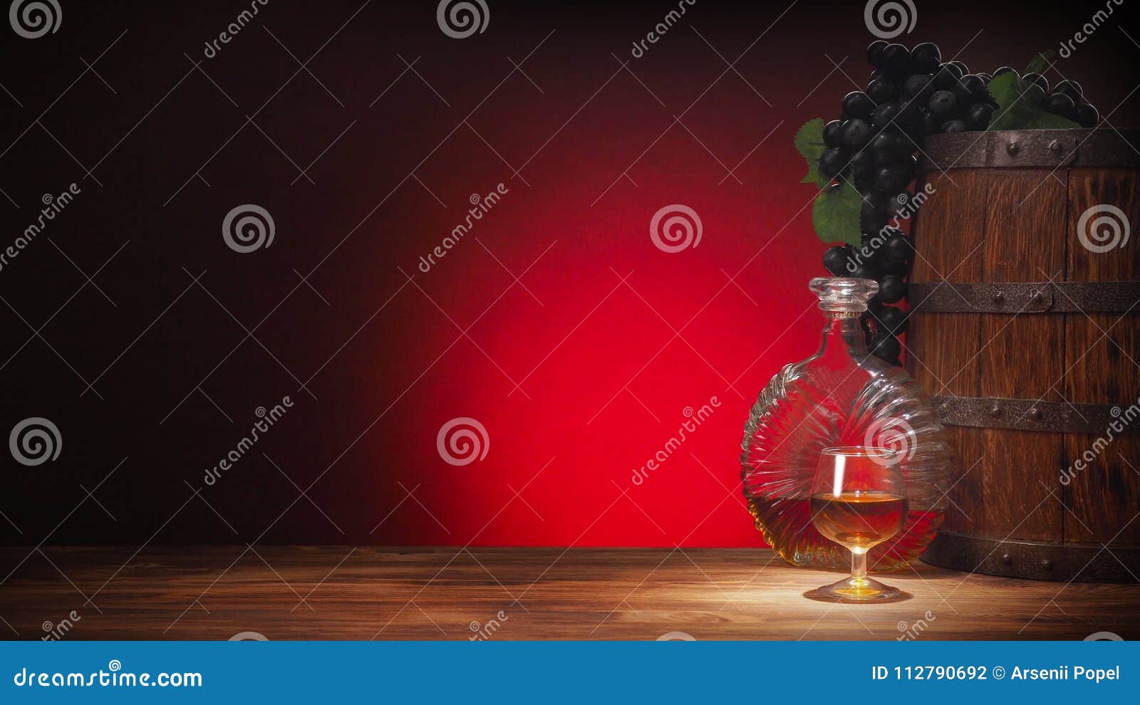 Glass of Cognac with Barrel on Red Backgroun Stock Photo - Image of
