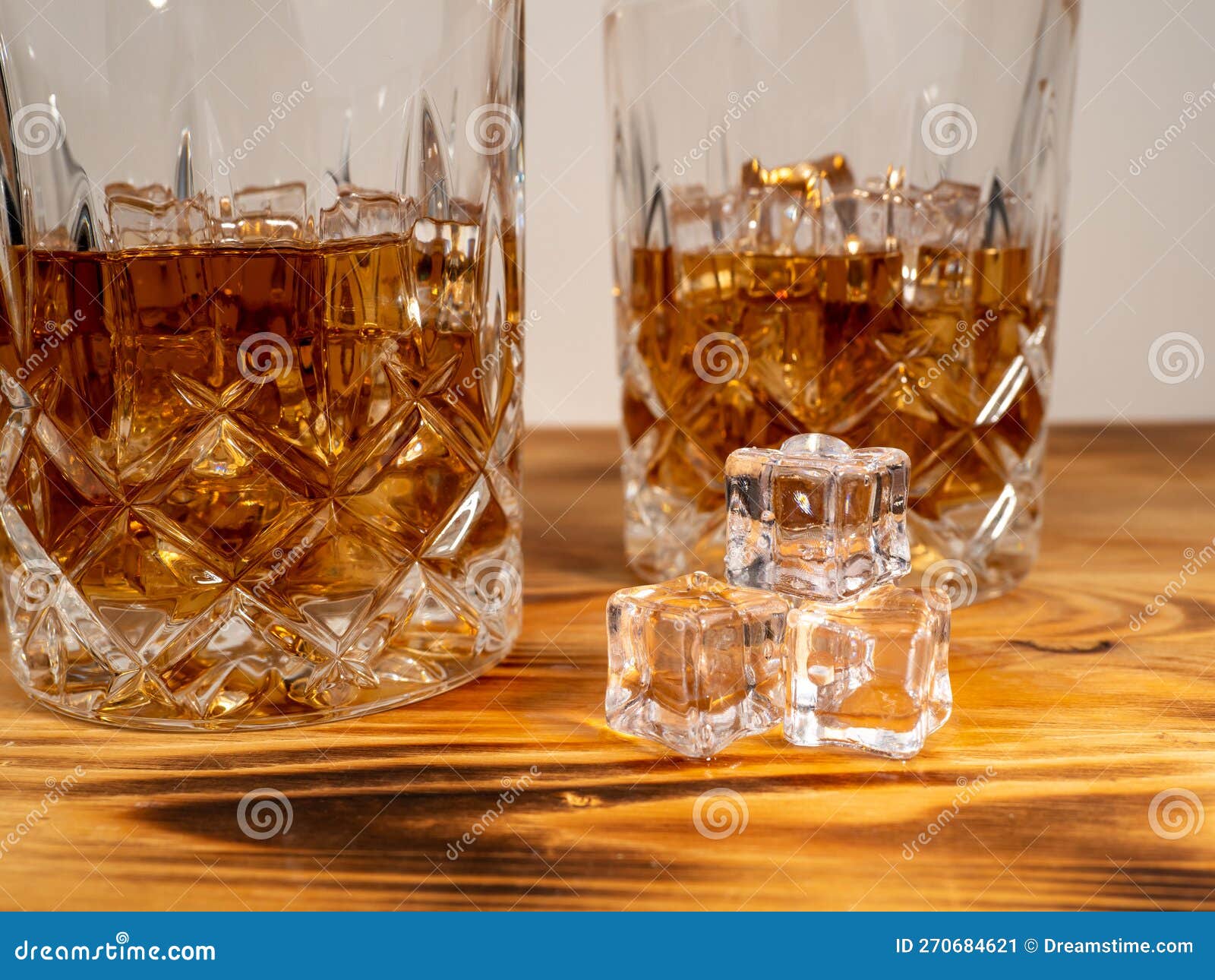 A Glass of Cognac with Ice Cubes. a Glass of Whiskey or Bourbon with