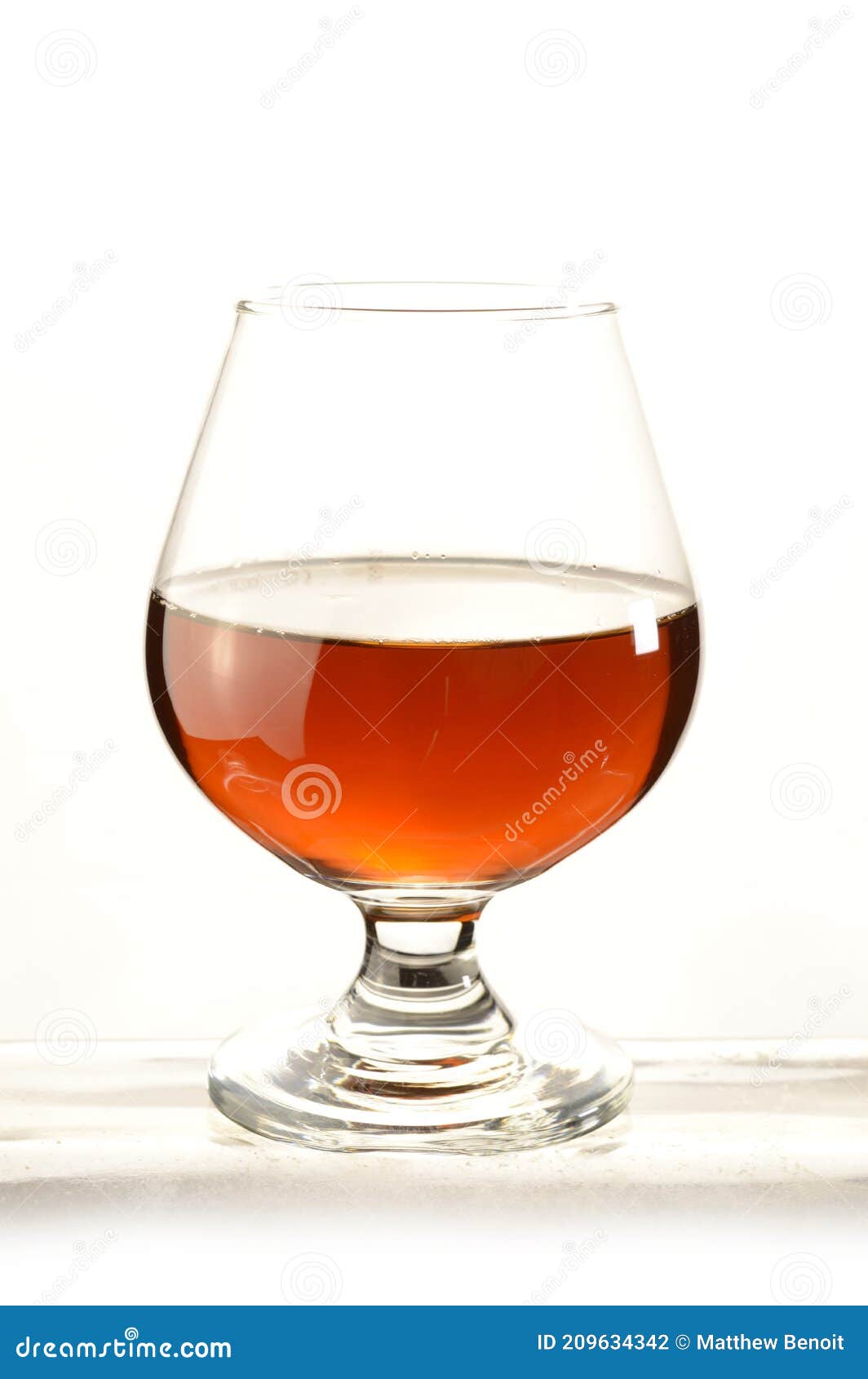 Glass of Cognac stock photo. Image of booze, isolated 209634342