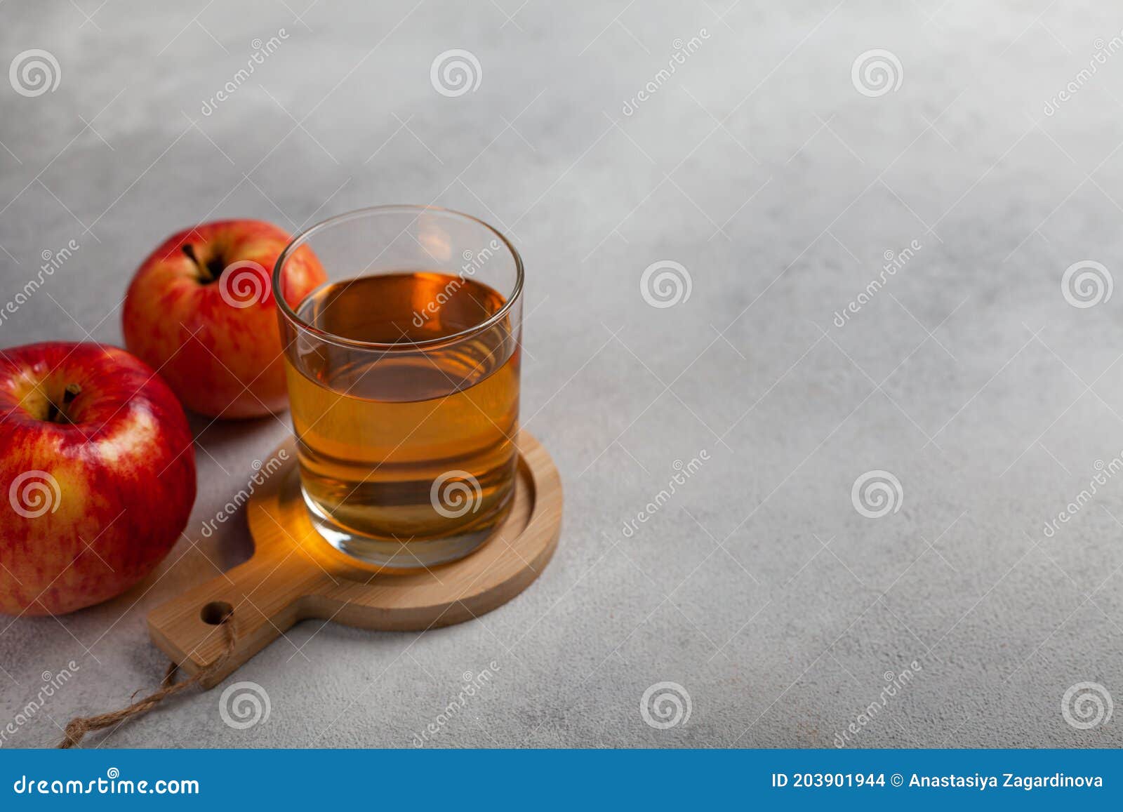Glass cup with apple juice stock photo. Image of beverage 203901944