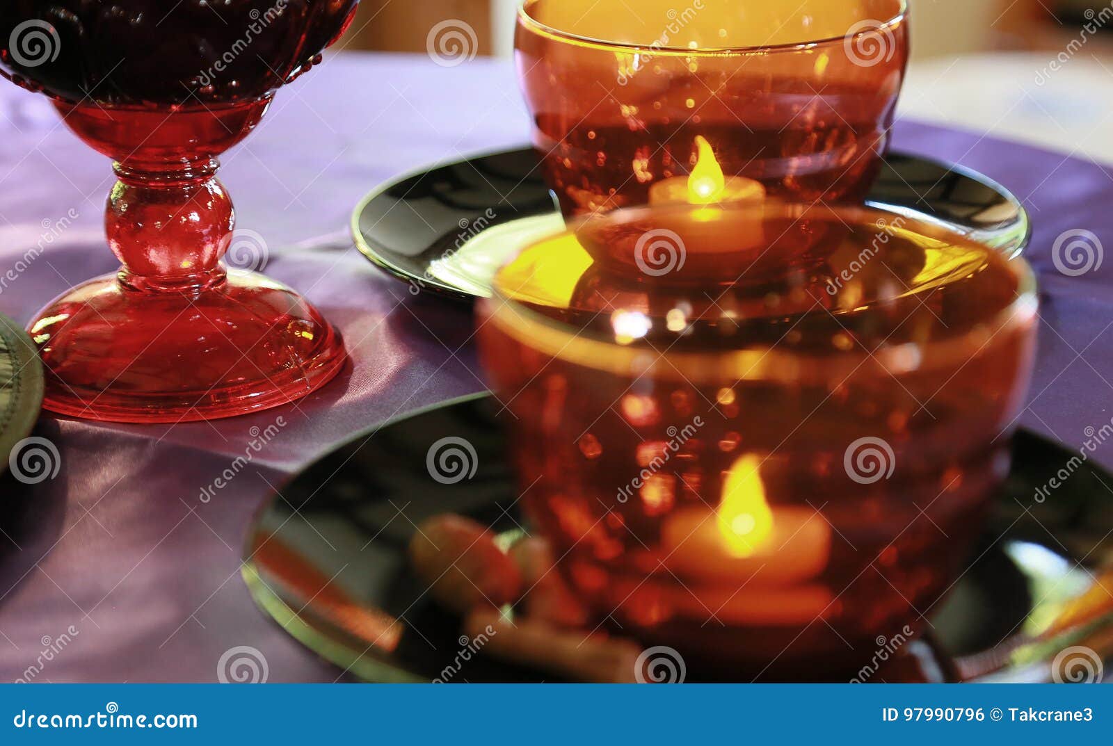 Glass cup and candle light stock photo. Image of spectacle 97990796