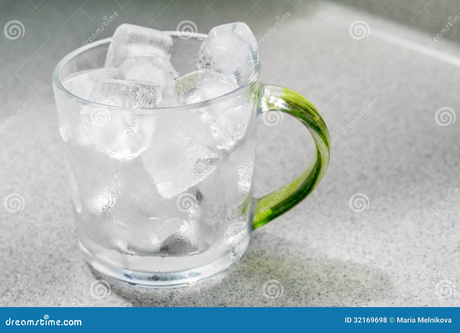 Glass cup with ice cubes stock photo. Image of transparent 32169698