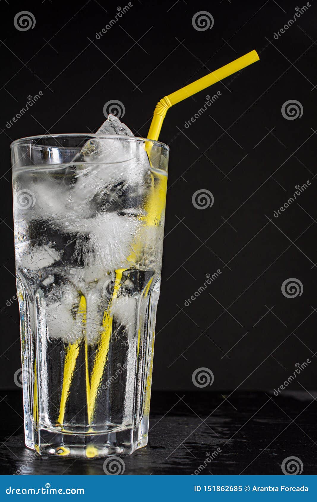 Glass Cup With Water Many Ice Cubes And Yellow Straw On A Black Background Stock Image Image Of Morning Clear