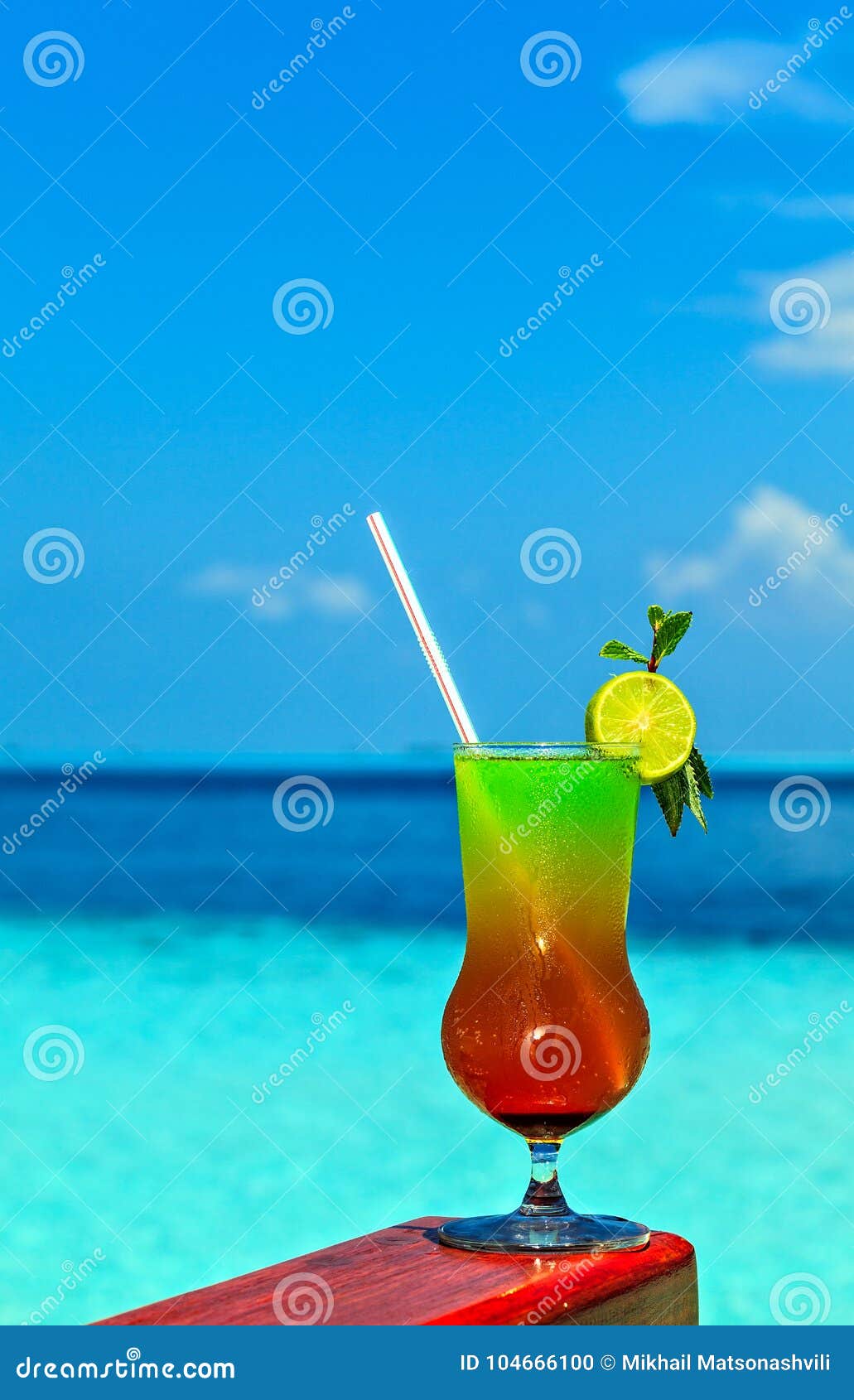 Glass of Drink is on a Beach Table Stock Photo Image of original