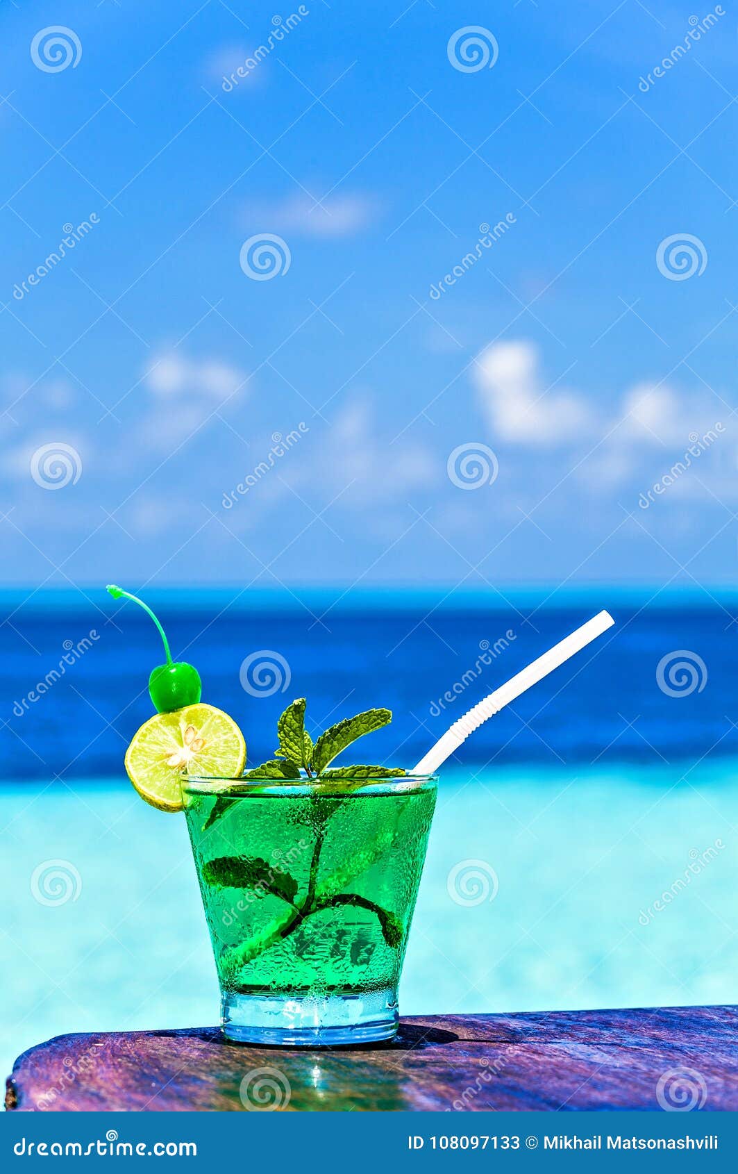 Glass of Drink is on a Beach Table Stock Image Image of resort, green