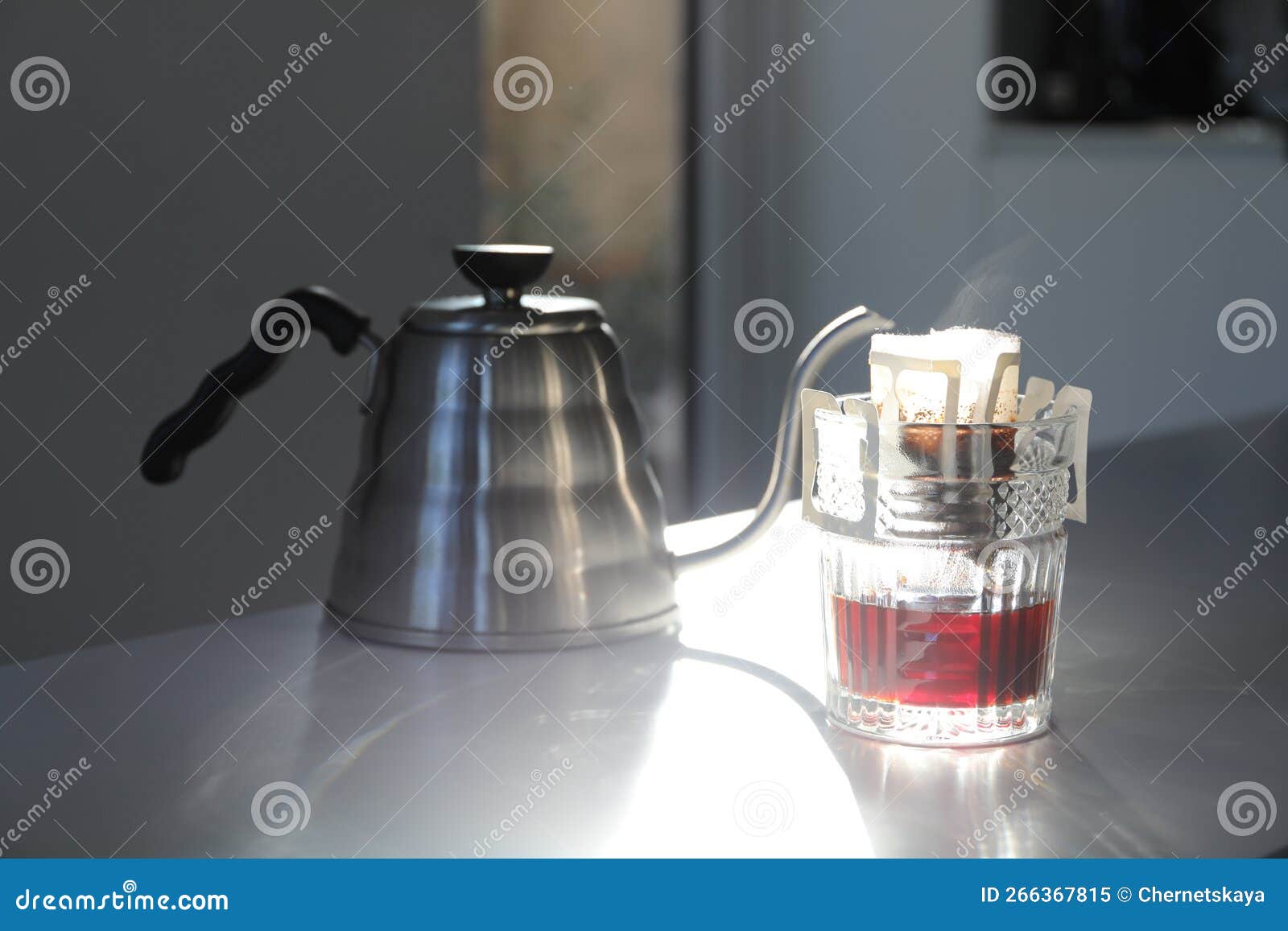 Glass with Drip Coffee Bag and Kettle on Light Grey Table Stock Image Image of grey, kettle