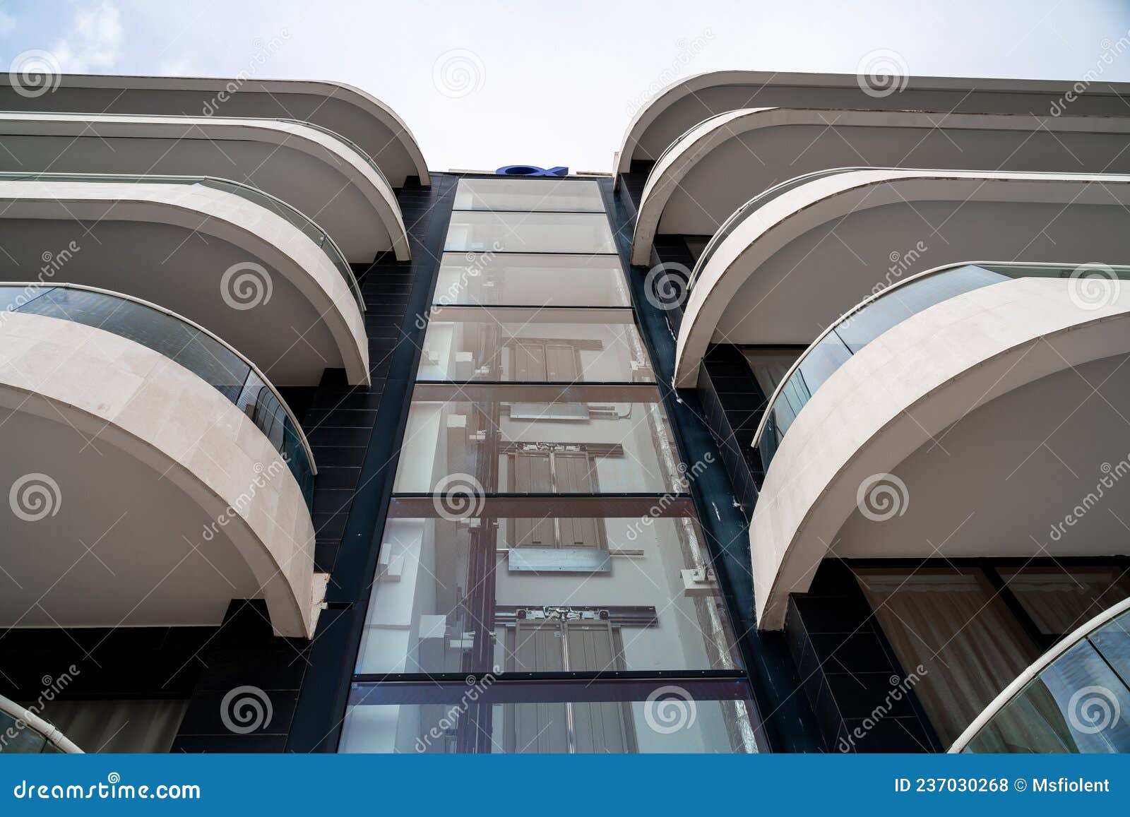 Glass Elevator in a Modern House, Hotel. the Elevator Rises between Two
