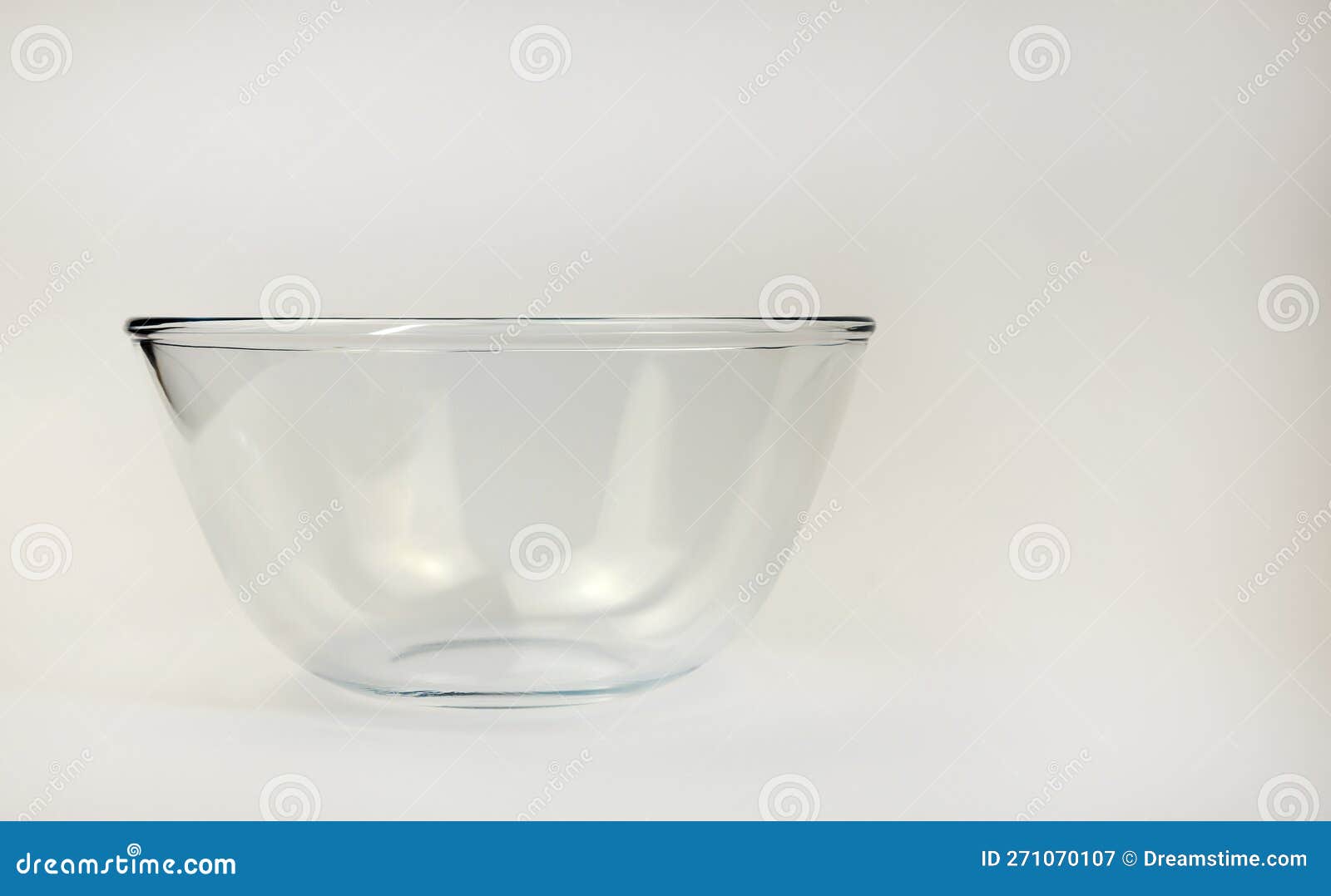 Glass Empty Salad Bowl on White Background. Cooking Concept. Stock