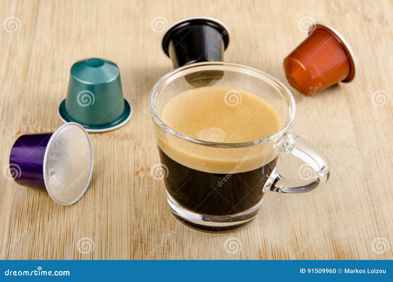 https://thumbs.dreamstime.com/z/glass-espresso-nespresso-capsules-around-91509960.jpg