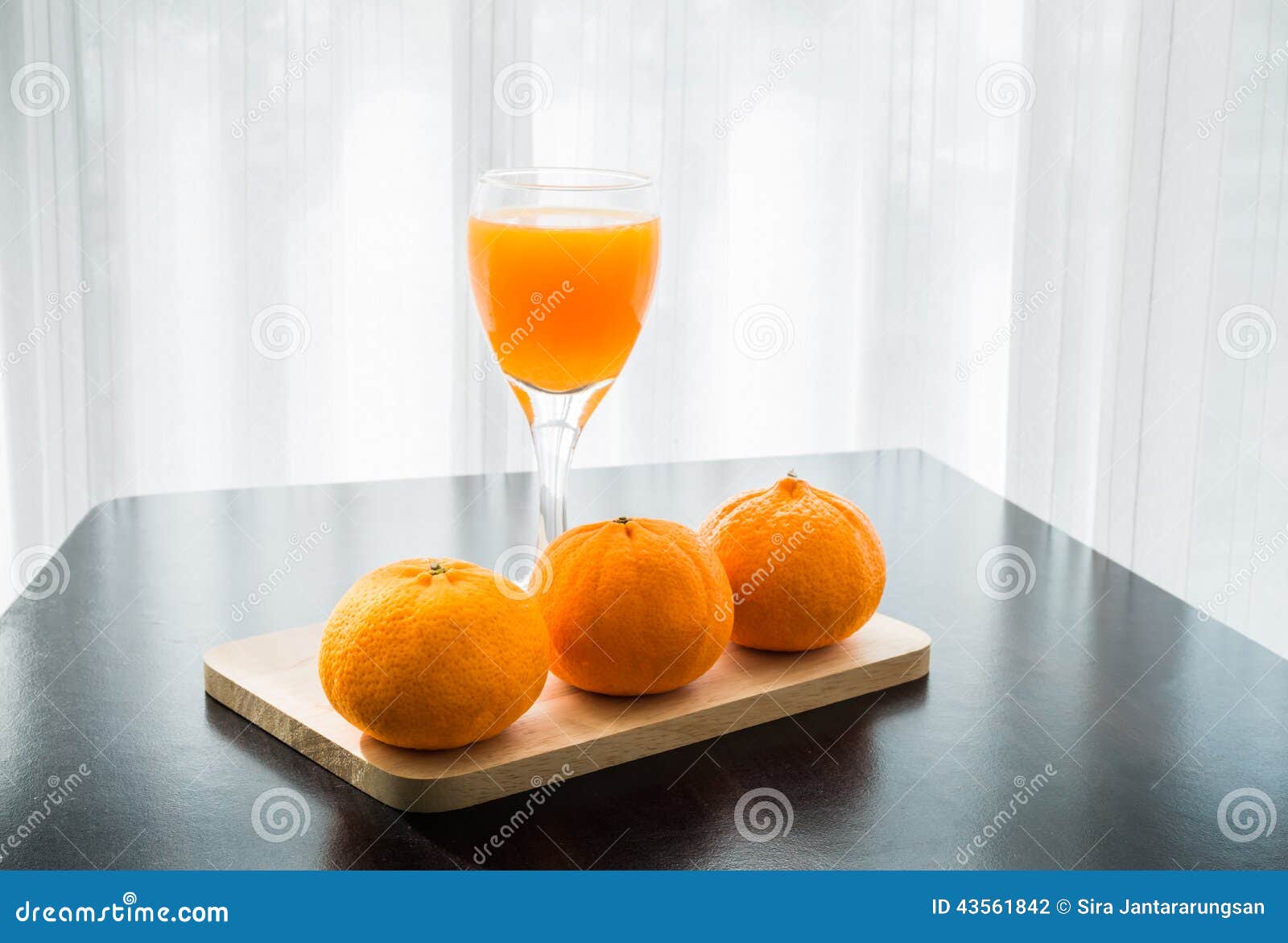 https://thumbs.dreamstime.com/z/glass-freshly-pressed-orange-juice-three-orange-wooden-table-43561842.jpg
