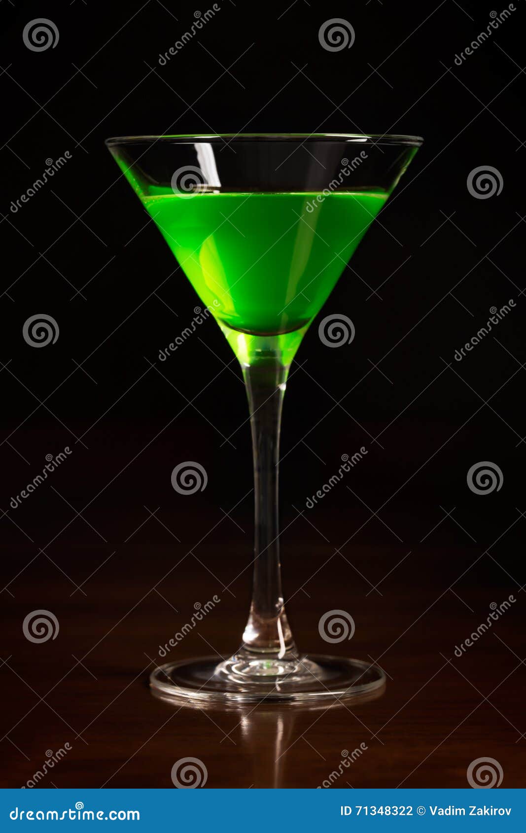 Glass of green cocktail stock photo. Image of black, party 71348322