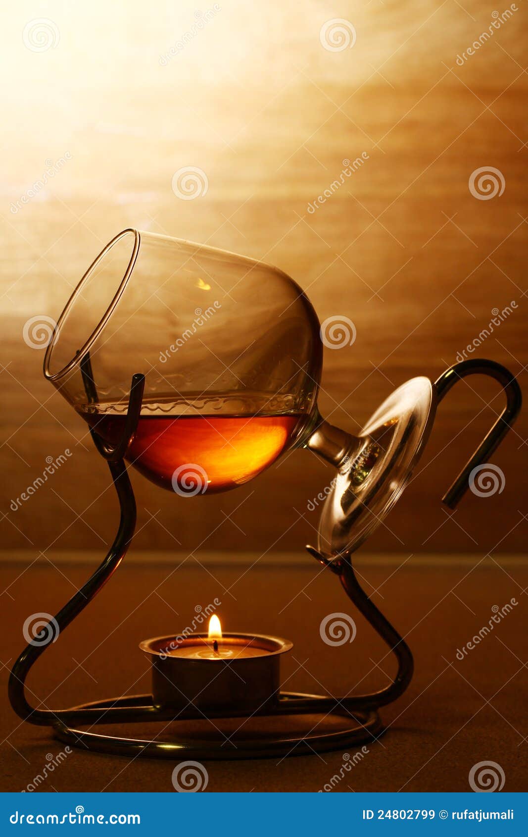 Glass of hot cognac stock image. Image of bottle, dark 24802799