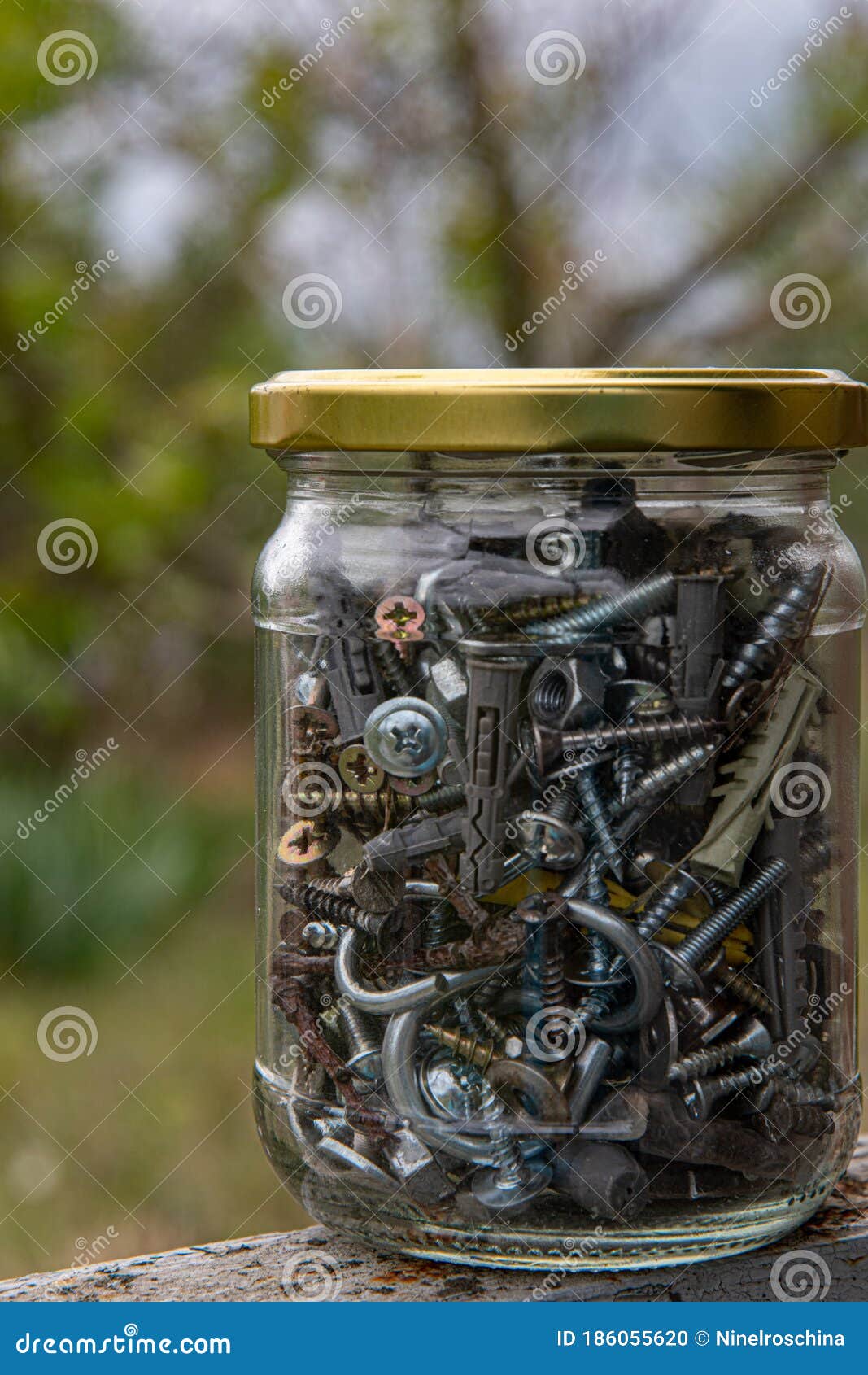 metalware storage inside jar with golden metal lid. industrial objects closeup