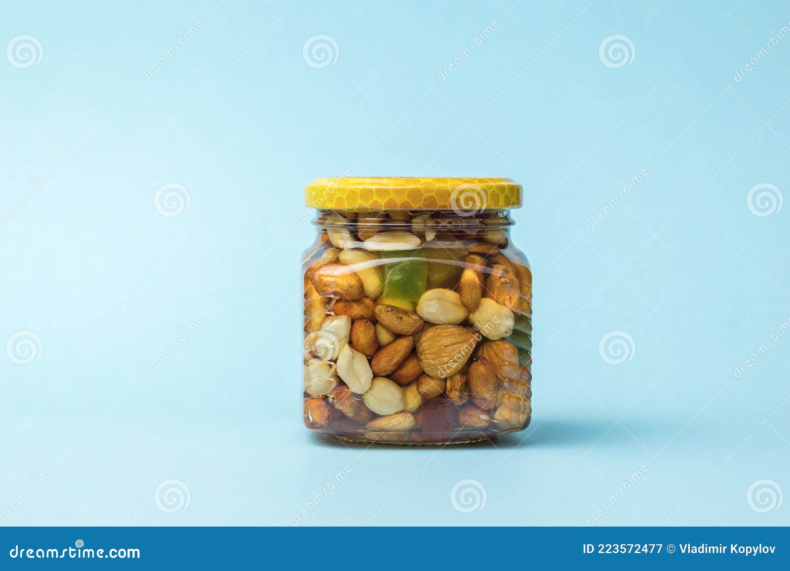 Healthy Mix Of Natural Honey With Different Nuts In A Jar On Blue Concrete  Background Stock Photo, Picture and Royalty Free Image. Image 109224603.