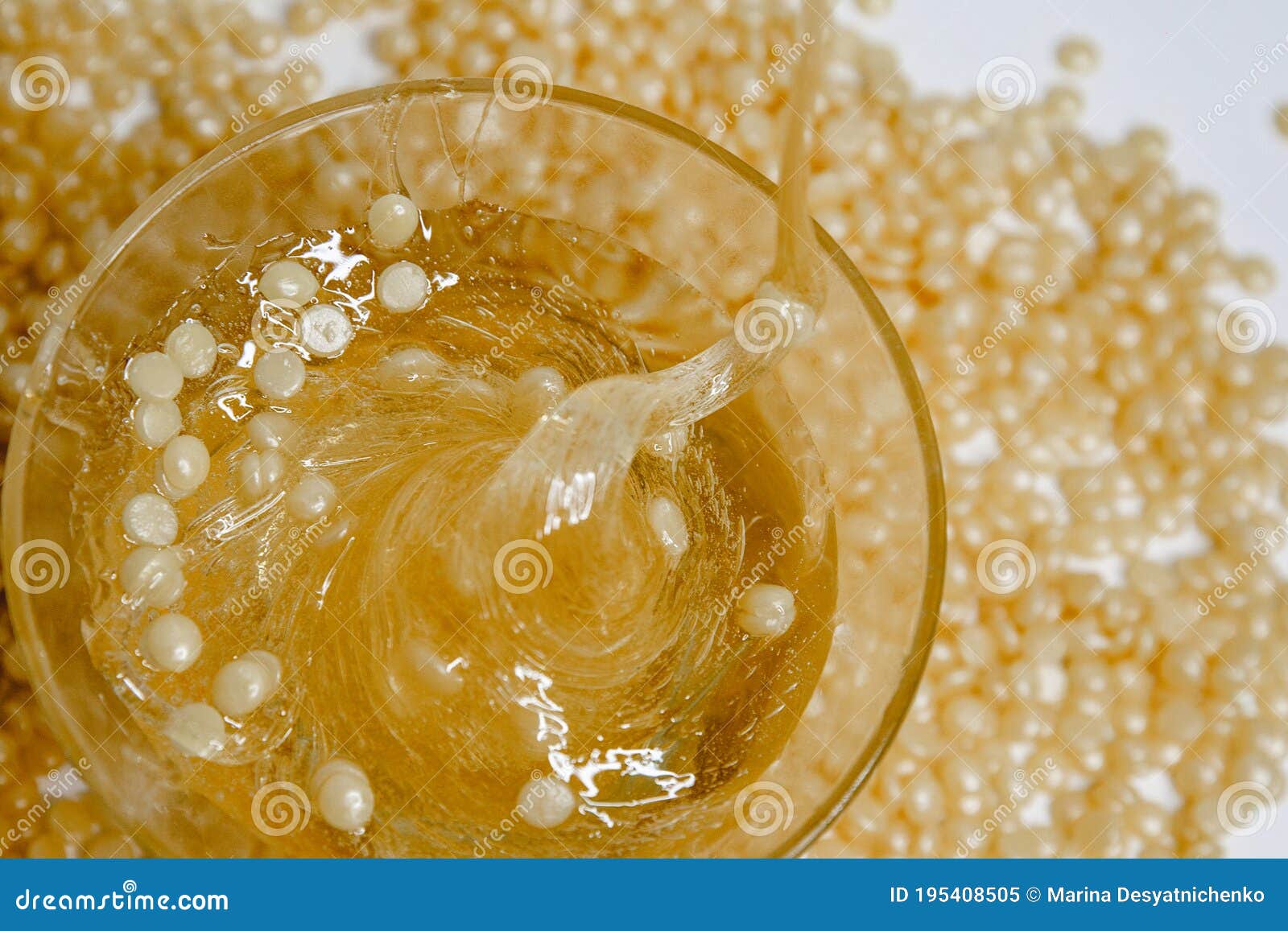 Glass Jar with Paste for Sugaring Closeup on the Background of