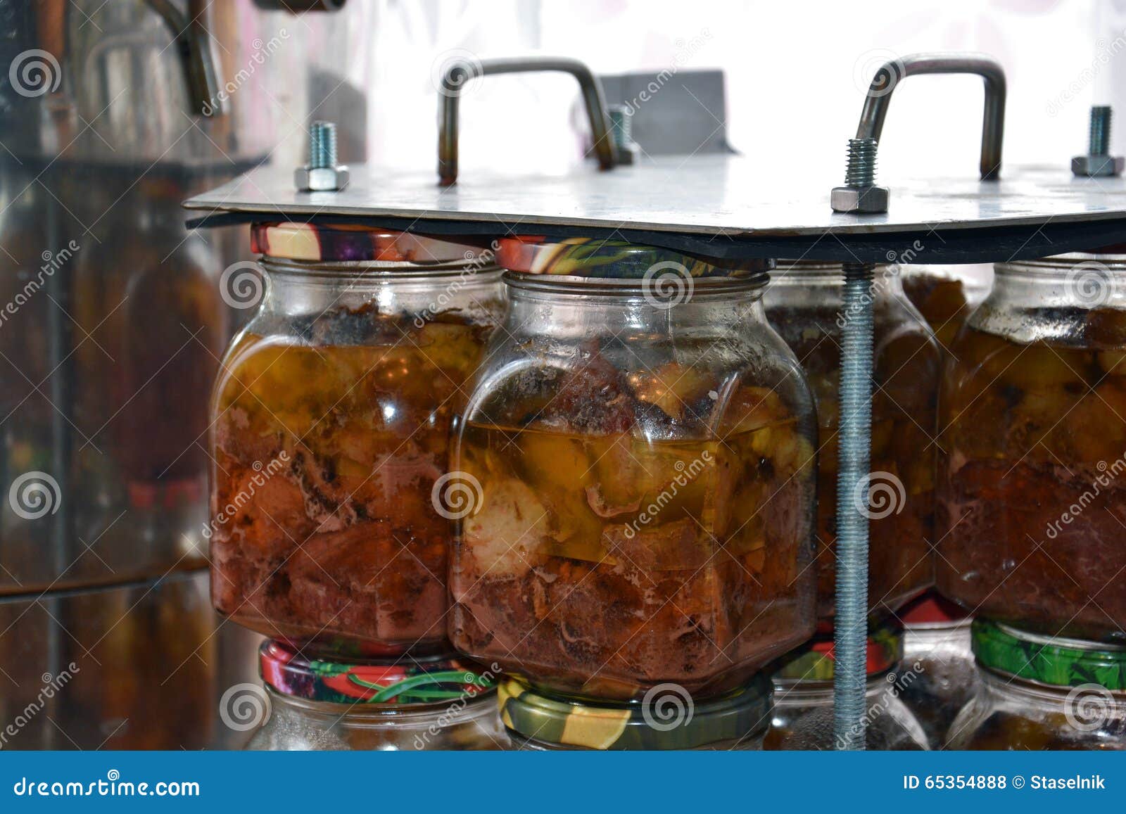Glass Jars of Stew in the Cassette after Autoclaving Stock Photo