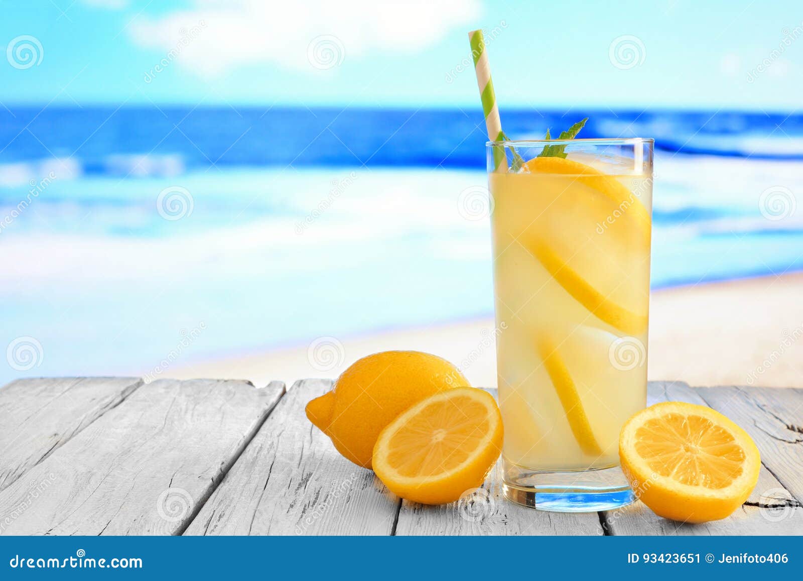 Glass Of Lemonade Against A Vibrant Blue Ocean Background