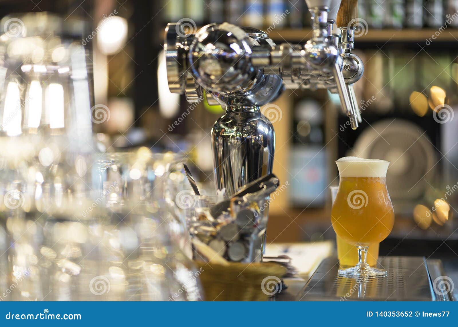 Glass of Light Beer, Serving Fresh Beer in Bar Counter Stock Photo