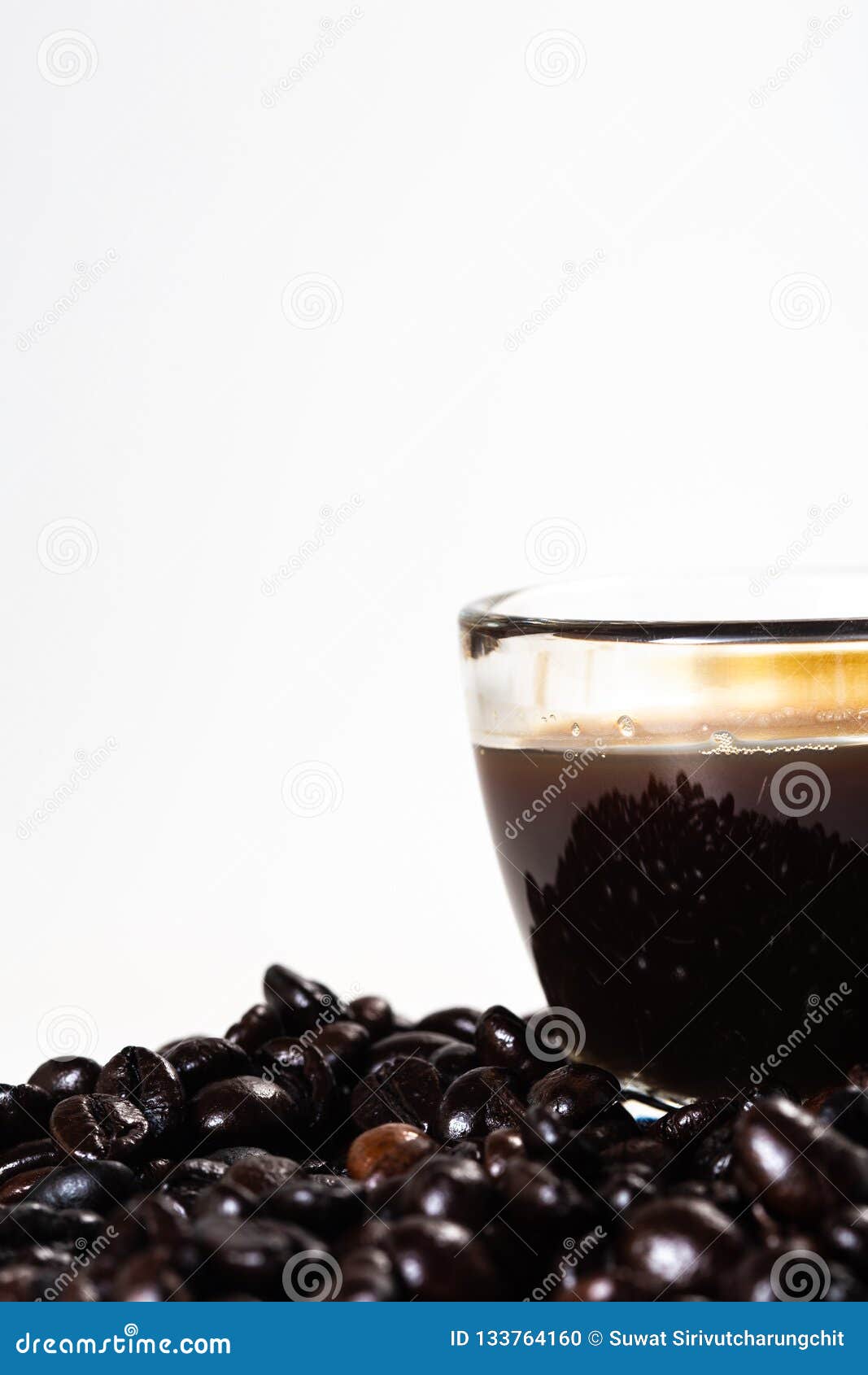the glass mug of coffee and coffee bean